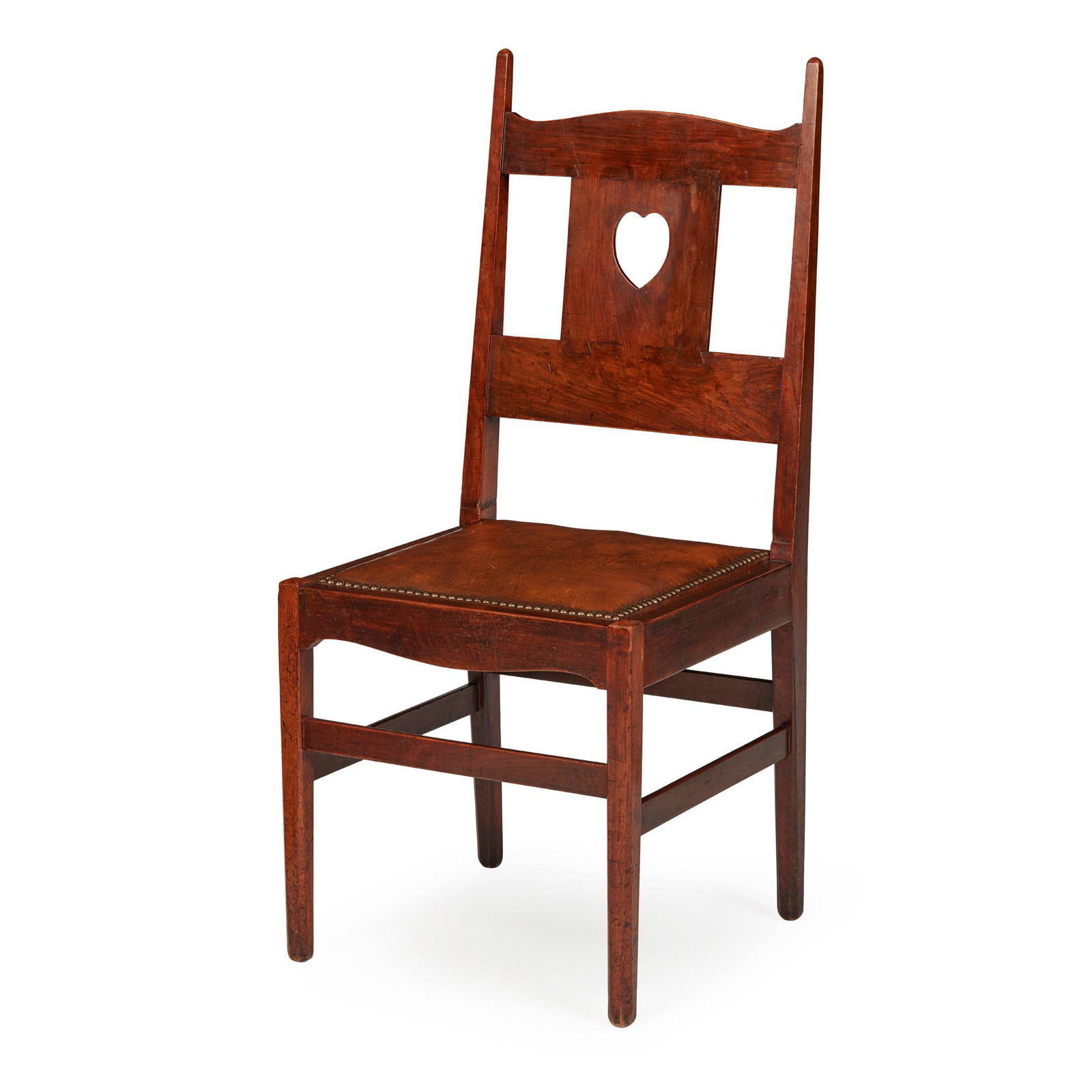 CHARLES FRANCIS ANNESLEY VOYSEY (BRITISH 1857-1941) SIDE CHAIR, CIRCA 1904: mahogany, with a heart-shaped cut out on the centre splat and close nailed drop-in leather pad seat(45.5cm (18 in) wide, 103cm (40 1/2 in) high, 44cm (17 1/4in) deep)Provenance: Dreweatt Neate, Newbur