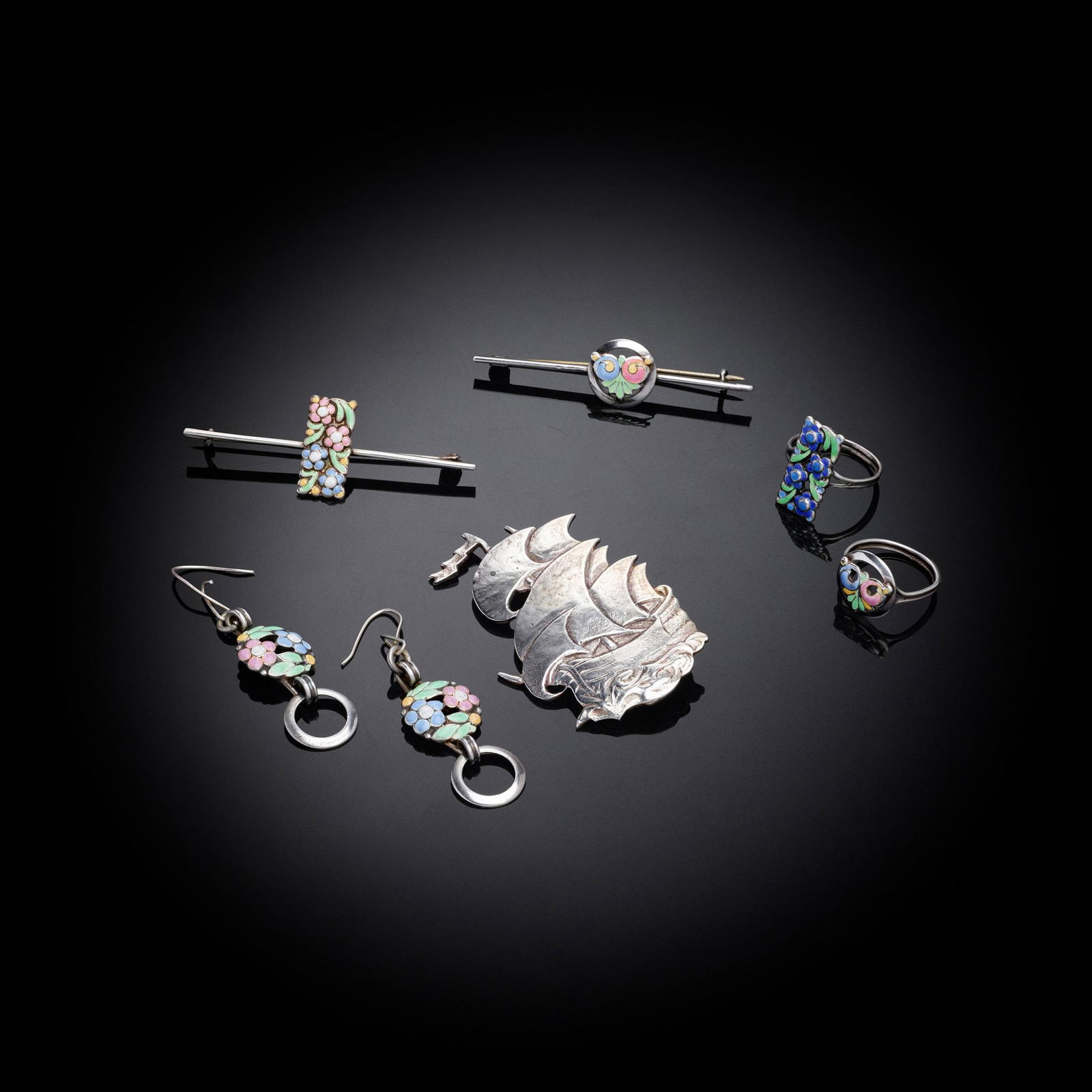 § BERNARD INSTONE (BRITISH 1891-1987) COLLECTION OF JEWELLERY: including a brooch of a galleon, stamped 'SILVER / B.I.', 5.8cm (2 1/4in) high, two bar brooches, two rings and a pair of earrings, one bar brooch and one ring stamped 'SILVER / B.I.', the largest bar