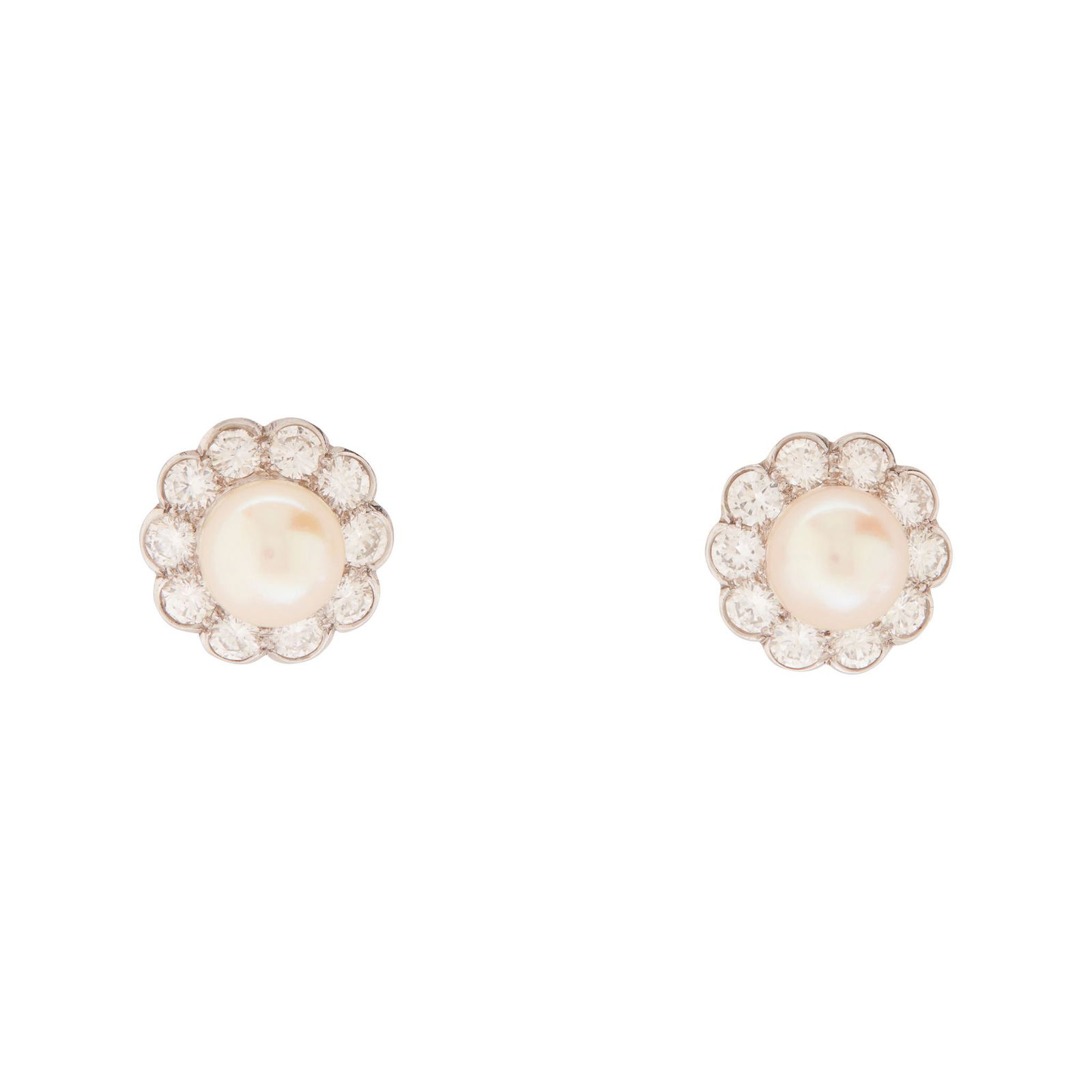 A pair of pearl and diamond cluster earrings: each set with a central pearl in a border of old round-cut diamonds, modelled in unmarked white metal, post and butterfly fittings, in a tooled red leather box by Cartier(Diameter: 1.3cm)
