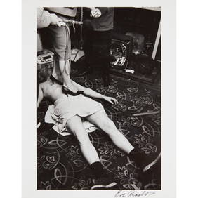 EVE ARNOLD O.B.E. (AMERICAN 1912-2012) LESBIAN WEDDING CELEBRATION (STILETTO HEELS ON MAN'S STOMACH) (1 of 2)
