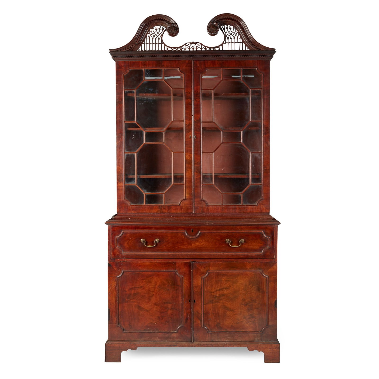 EARLY GEORGE III MAHOGANY BUREAU BOOKCASE, IN THE MANNER OF THOMAS CHIPPENDALE MID 18TH CENTURY: EARLY GEORGE III MAHOGANY BUREAU BOOKCASE, IN THE MANNER OF THOMAS CHIPPENDALE MID 18TH CENTURY the moulded swan neck pediment with carved rose terminals and fretwork inserts above a key moulded friez