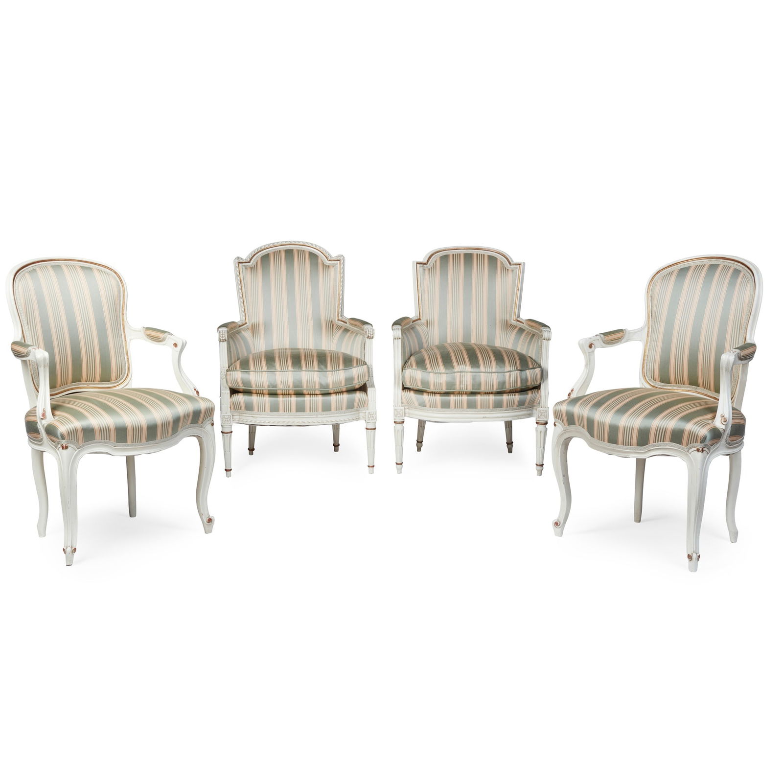TWO PAIRS OF IVORY PAINTED FRENCH ARMCHAIRS LATE 19TH/ EARLY 20TH CENTURY: TWO PAIRS OF IVORY PAINTED FRENCH ARMCHAIRS LATE 19TH/ EARLY 20TH CENTURY comprising a pair of Louis XV style chaises en cabriolet with cartouche shaped backs, part-padded arms and serpentine seats, o