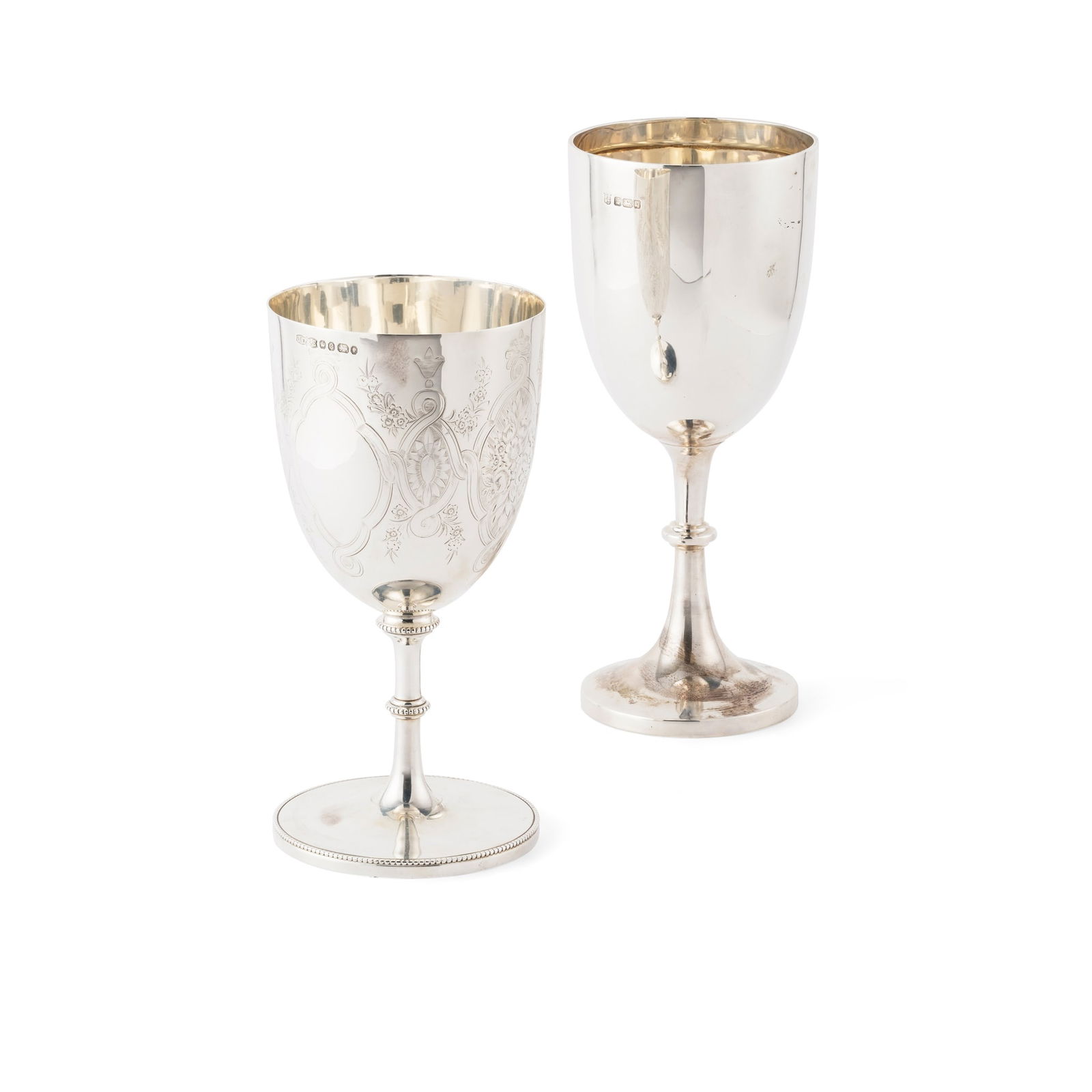 An Edwardian goblet: An Edwardian goblet James Deakin & Sons, Sheffield 1908, of traditional outline, knopped stem, to a circular foot; together with another, John Dixon and Sons, Sheffield 1870, with engraved floral deco