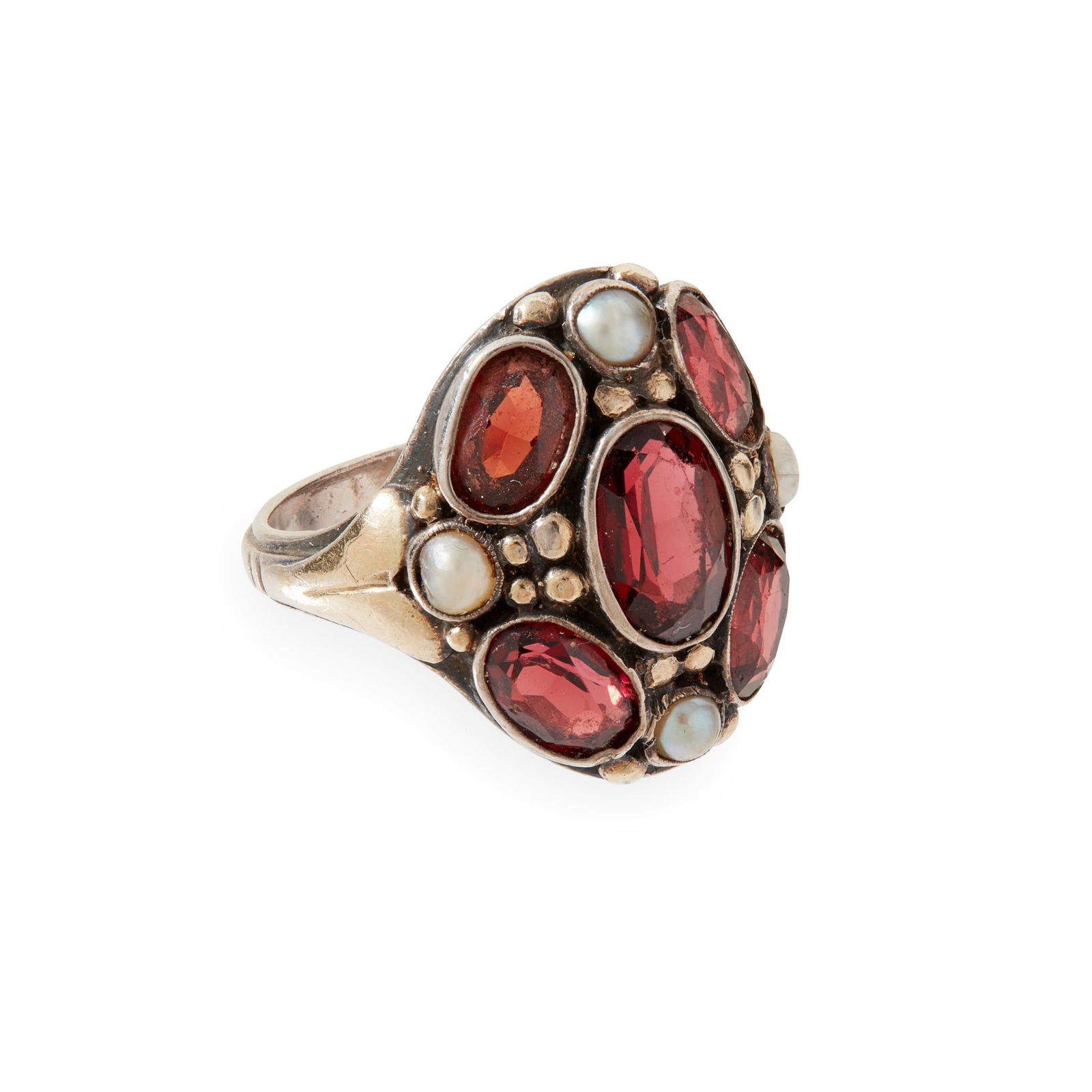 BERNARD INSTONE (1891-1987) ARTS & CRAFTS RING, CIRCA 1920: BERNARD INSTONE (1891-1987) ARTS & CRAFTS RING, CIRCA 1920 silver, set with garnets and seed pearls, stamped B.I./ SILVER (ring size L)