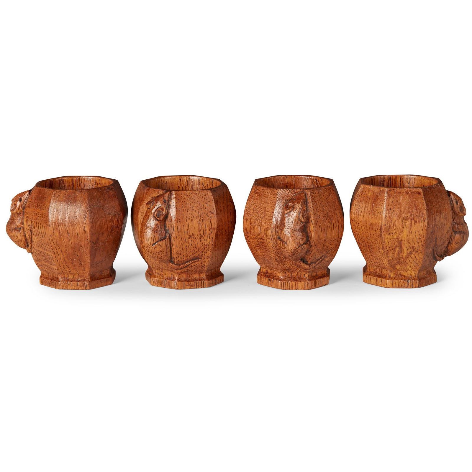 ROBERT ‘MOUSEMAN’ THOMPSON (1876-1955) SET OF FOUR EGG CUPS, CIRCA 1960's-70's: ROBERT ‘MOUSEMAN’ THOMPSON (1876-1955) SET OF FOUR EGG CUPS, CIRCA 1960's-70's oak, each with carved mouse signature (each 5cm high) Qty: (4)