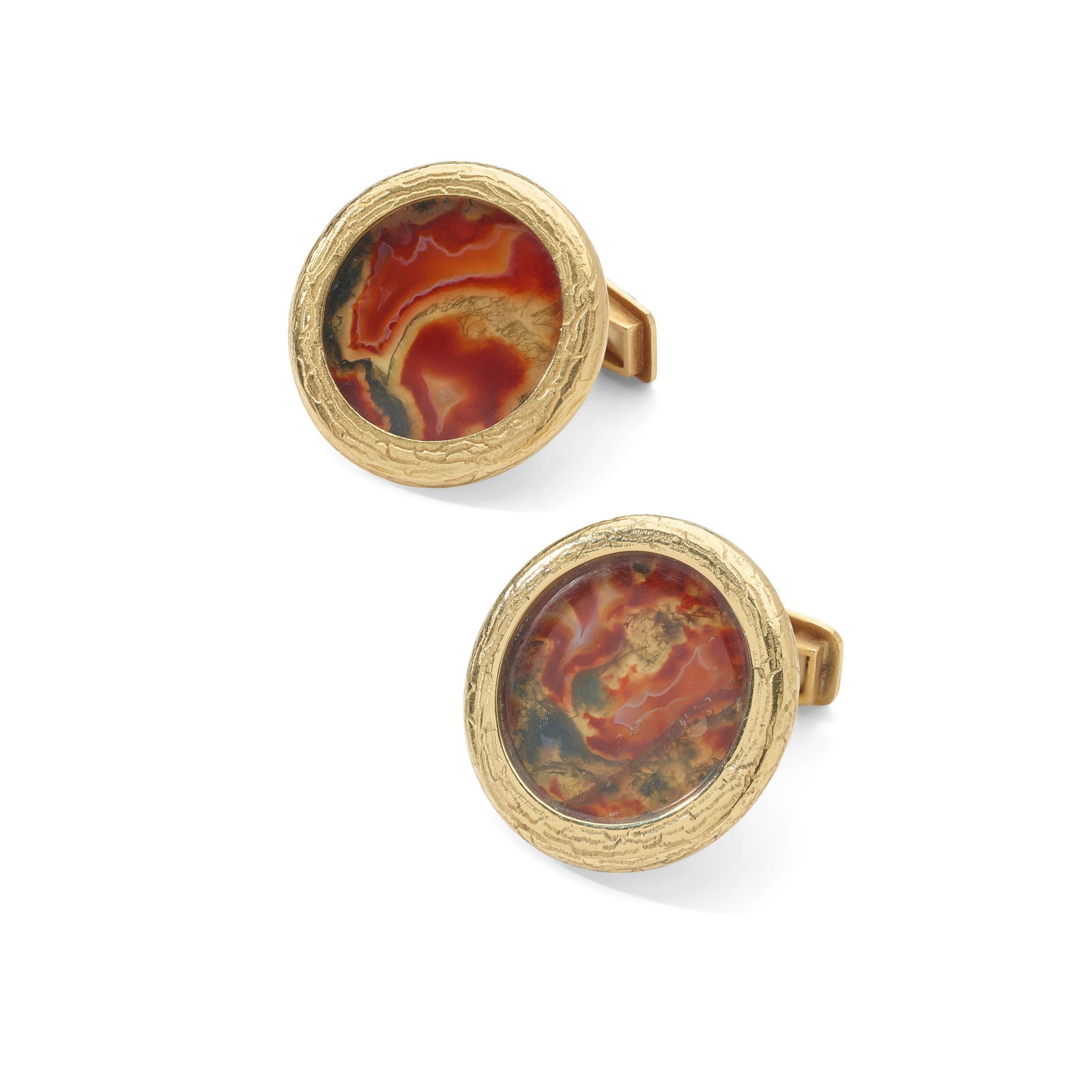 § Andrew Grima: A pair of moss agate cufflinks, 1973: § Andrew Grima: A pair of moss agate cufflinks, 1973 Each circular moss agate plaque within an 18ct gold textured frame, to a rectangular panel terminal, signed Grima, maker's mark, UK hallmark (