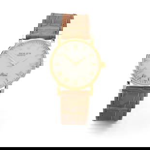 Y Rolex: An 18ct gold wristwatch: Y Rolex: An 18ct gold wristwatch Cellini model 5115, 18ct gold case, manual wind movement, white dial with ‘Rolex’ in repeat, applied gold Roman numerals, gold sword hands, crown with coro