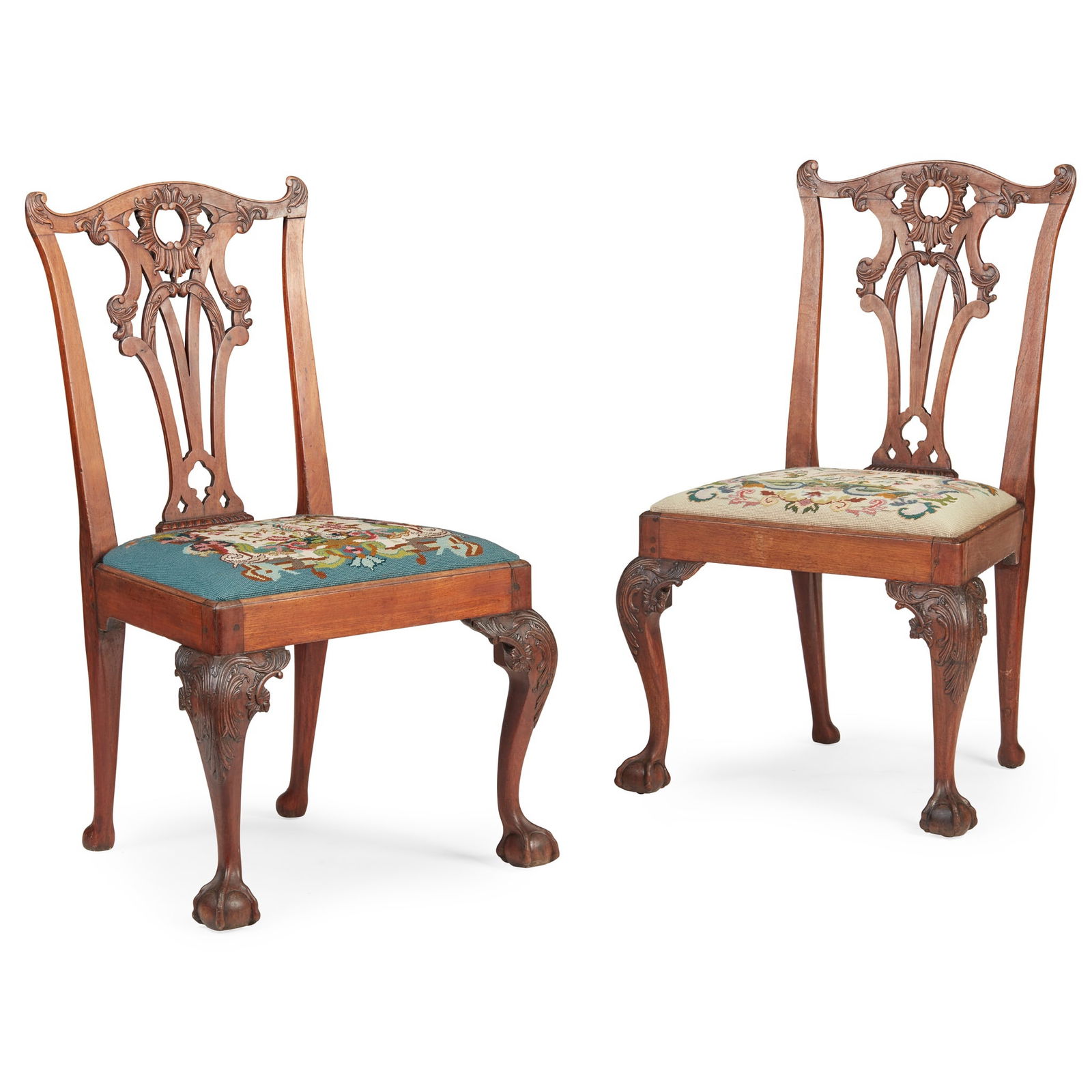 PAIR OF GEORGE III CHIPPENDALE STYLE MAHOGANY SIDE CHAIRS, IN THE MANNER OF THOMAS CHIPPENDALE MID: PAIR OF GEORGE III CHIPPENDALE STYLE MAHOGANY SIDE CHAIRS, IN THE MANNER OF THOMAS CHIPPENDALE MID 18TH CENTURY the carved backs with pierced and interlaced splats, above drop-in seats with needlework