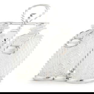 ELECTROPLATED DOUBLE SPIRIT TANTALUS, BY HUKIN AND HEATH EARLY 20TH CENTURY: ELECTROPLATED DOUBLE SPIRIT TANTALUS, BY HUKIN AND HEATH EARLY 20TH CENTURY containing two cut glass decanters of swollen form, within a stand with a loop handle and a novelty lock in the form of a pa
