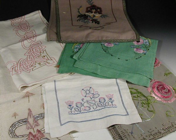A collection of Scottish Arts and Crafts: A collection of Scottish Arts and Crafts textiles,to include table runners, table cloths, napkins etc., each embroidered with stylised plant forms (qty)