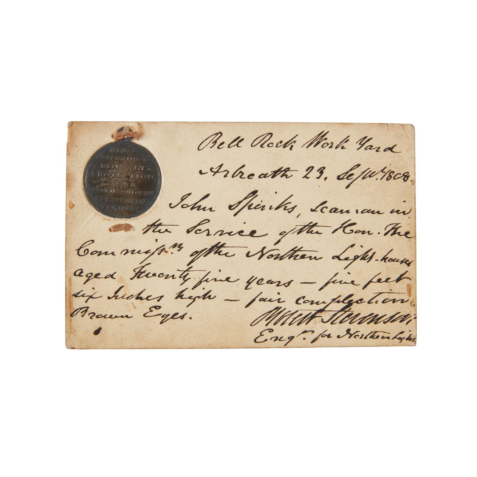 Bell Rock Work Yard Medal Admiralty protection medal - granted to John Spinks: Admiralty protection medal - granted to John Spinks White metal medal, 3 x 2.5cm, laid into a card, the medal reading: “Medal referring to Admiralty Protection and a description of the person by