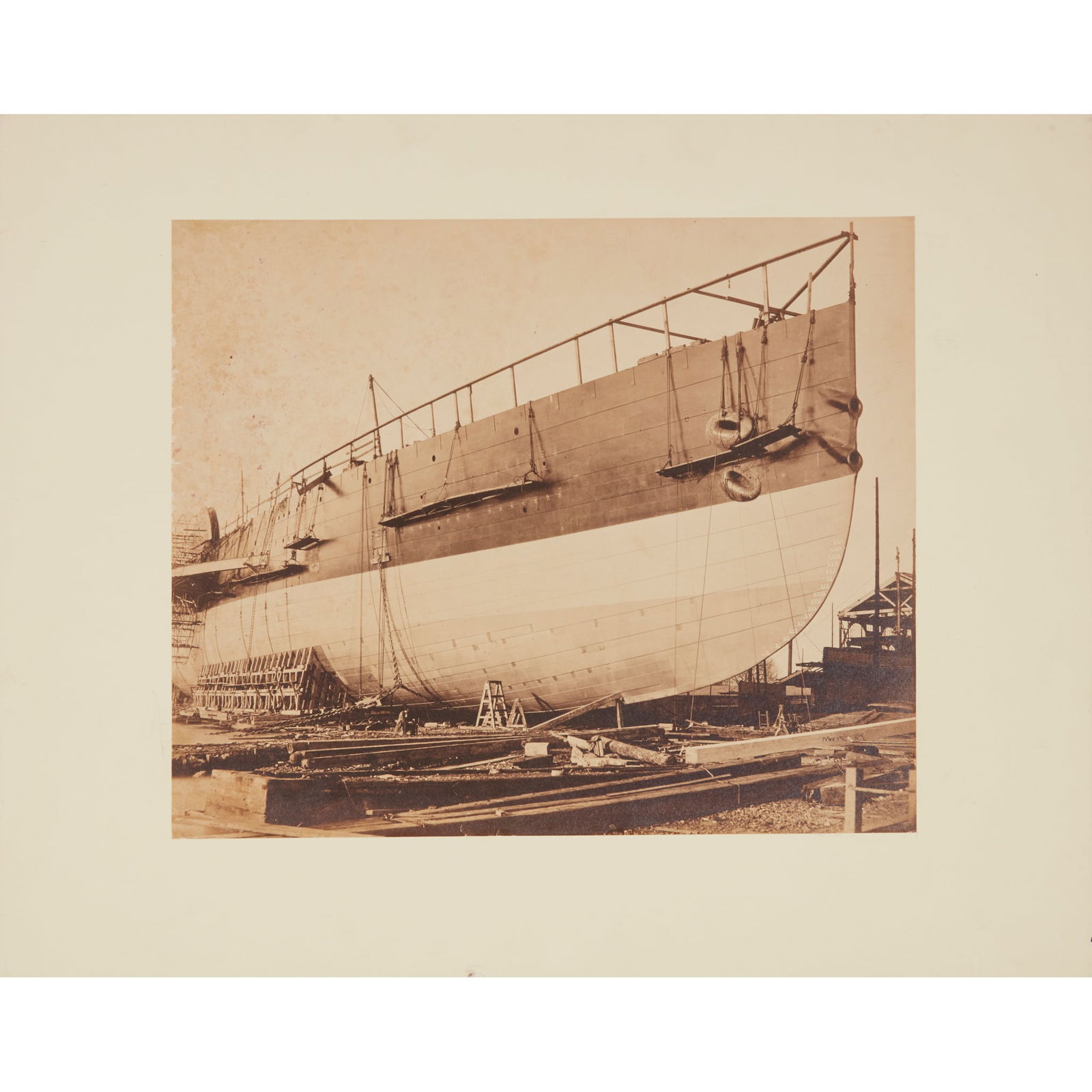 Robert Howlett (1831-1858) Starboard bow of the Great Eastern, 12th November 1857: Starboard bow of the Great Eastern, 12th November 1857 albumen print photograph (28.5 x 34cm), dated in negative, laid down on recent mount, spotting above skyline, a hint of rubbing and two short clo