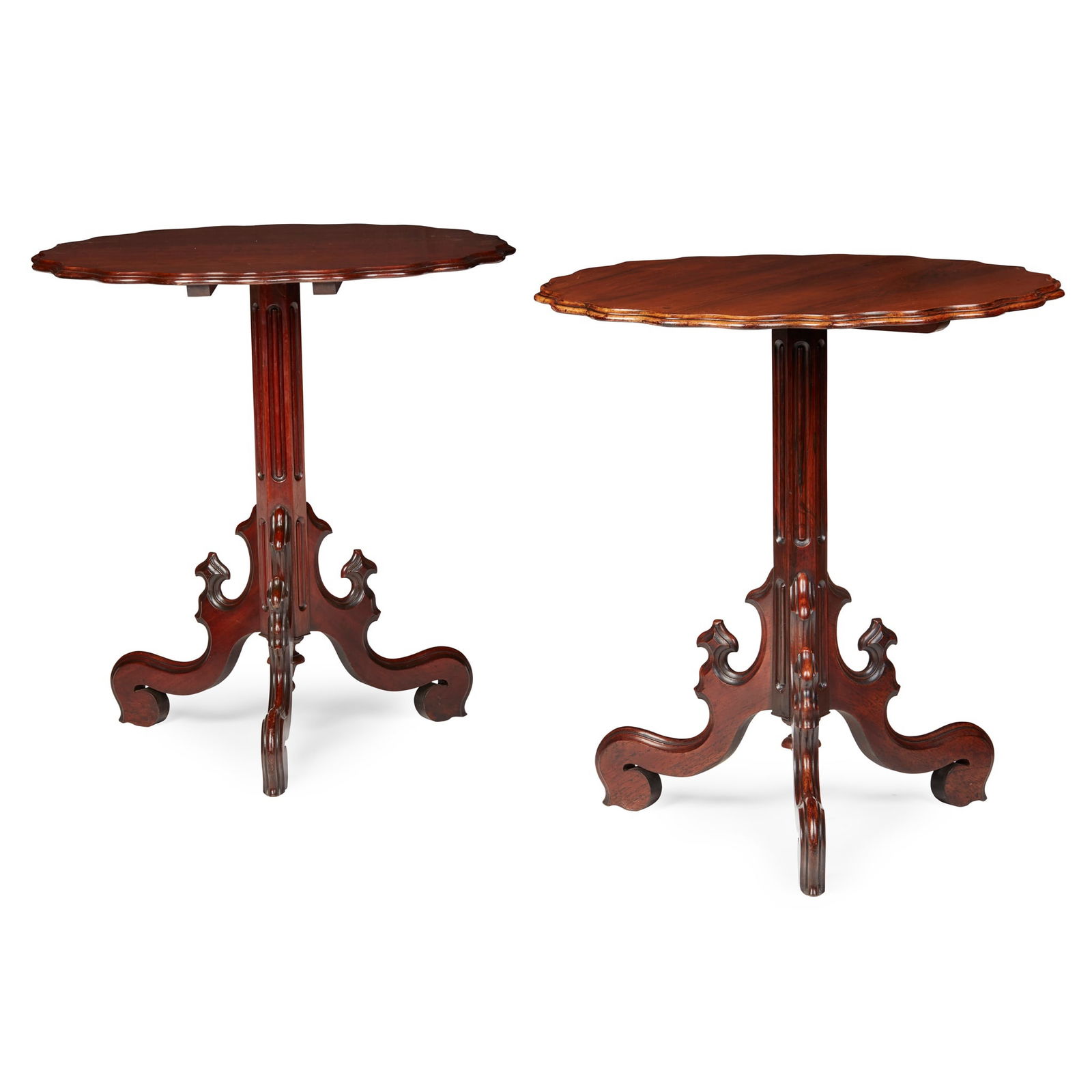 MATCHED PAIR OF FRENCH GOTHIC REVIVAL TEA TABLES: MATCHED PAIR OF FRENCH GOTHIC REVIVAL TEA TABLES MID 19TH CENTURY one in mahogany, the other rosewood, of matching design and size, the shaped tilt tops with a moulded edge on fluted columns and scrol