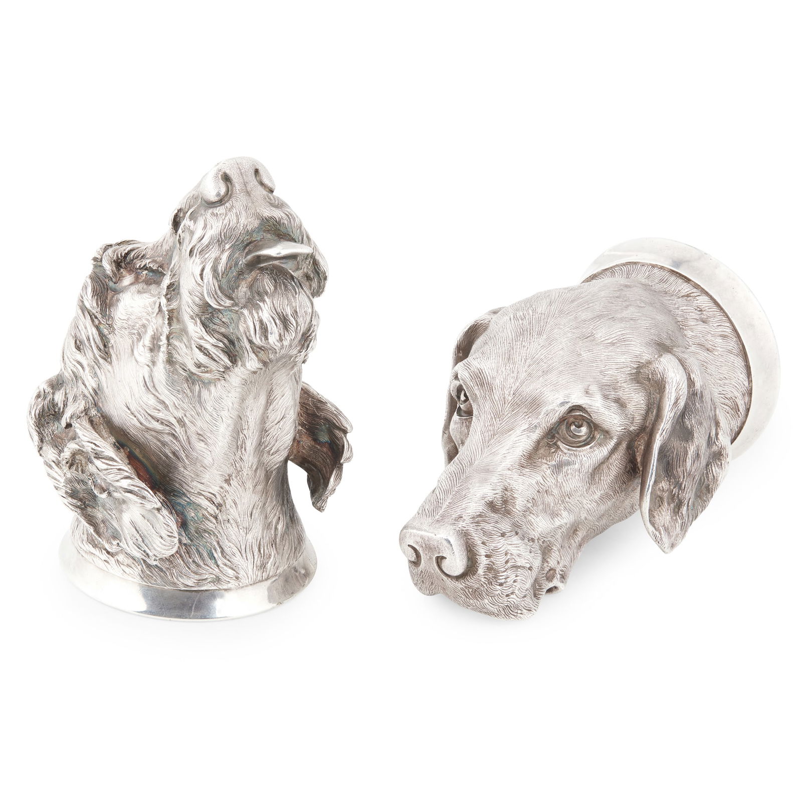 A pair of mid-late Victorian gun dog stirrup cups: A pair of mid-late Victorian gun dog stirrup cups unmarked, attributed the design of James Barclay Hennell (1827-1899), each modelled naturalistically with gilt interiors, one modelled as a wolfhound,