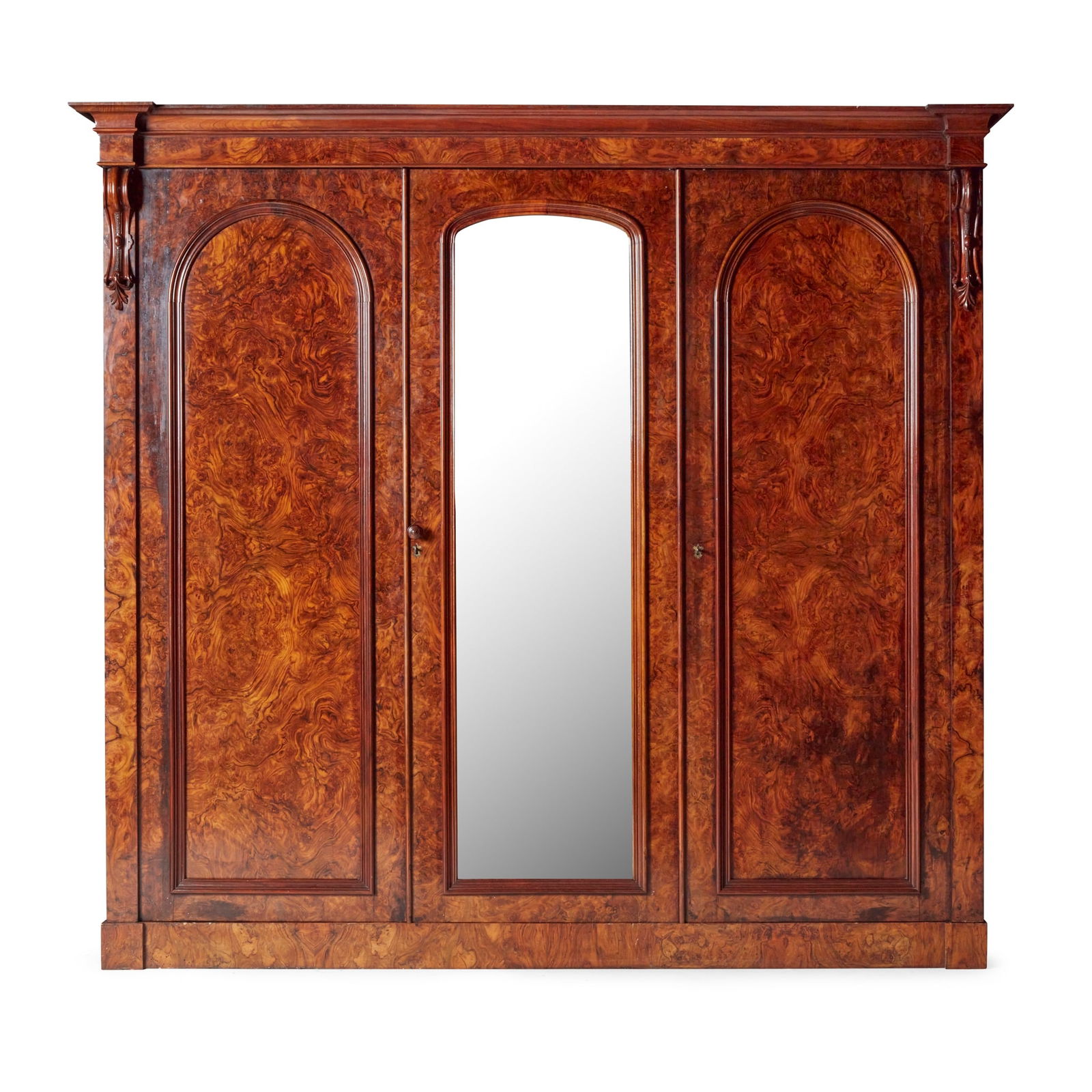VICTORIAN BURR WALNUT TRIPLE WARDROBE, BY JOHN TAYLOR & SONS, EDINBURGH: VICTORIAN BURR WALNUT TRIPLE WARDROBE, BY JOHN TAYLOR & SONS, EDINBURGH 19TH CENTURY the projecting moulded cornice over a central arched mirrored door flanked by two further doors, opening to hanging