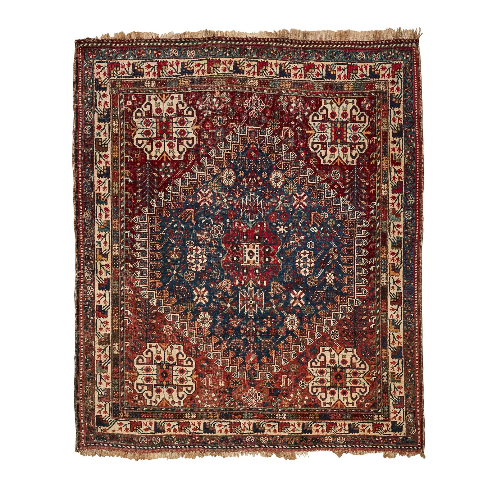 QASHQAI RUG: QASHQAI RUG SOUTH PERSIA, LATE 19TH/EARLY 20TH CENTURY the indigo field with red medallion, red and ivory spandrels, within ivory border 160cm x 135cm