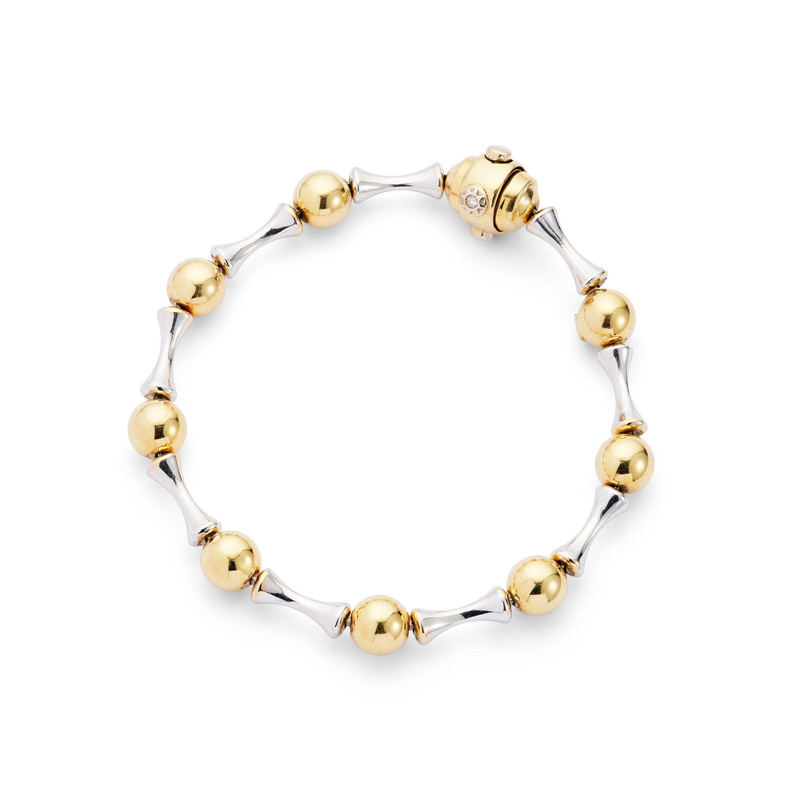 Chimento: An 18ct gold bracelet: Chimento: An 18ct gold bracelet Composed of alternating ball and tapered baton links, the clasp set with a small round brilliant-cut diamond, UK hallmarks Length: 18.5cm