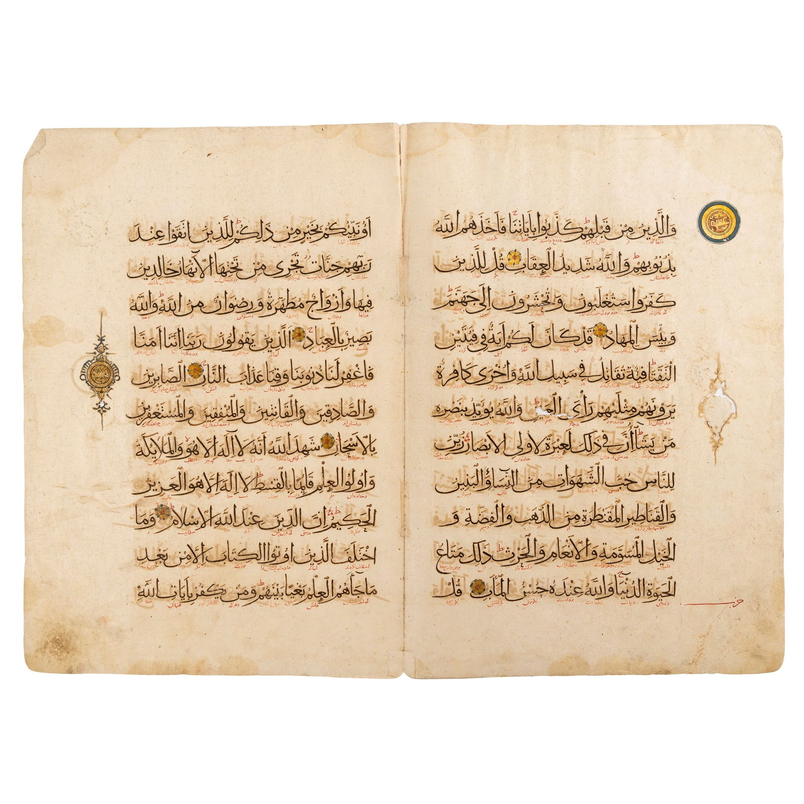 A BI-FOLIUM FROM A DISPERSED ILKHANID MANUSCRIPT OF THE QUR’AN: A BI-FOLIUM FROM A DISPERSED ILKHANID MANUSCRIPT OF THE QUR’AN PERSIA, 14th CENTURY Arabic manuscript on paper, conjoined pages, 11 lines to the page written in elegant black naskh script,