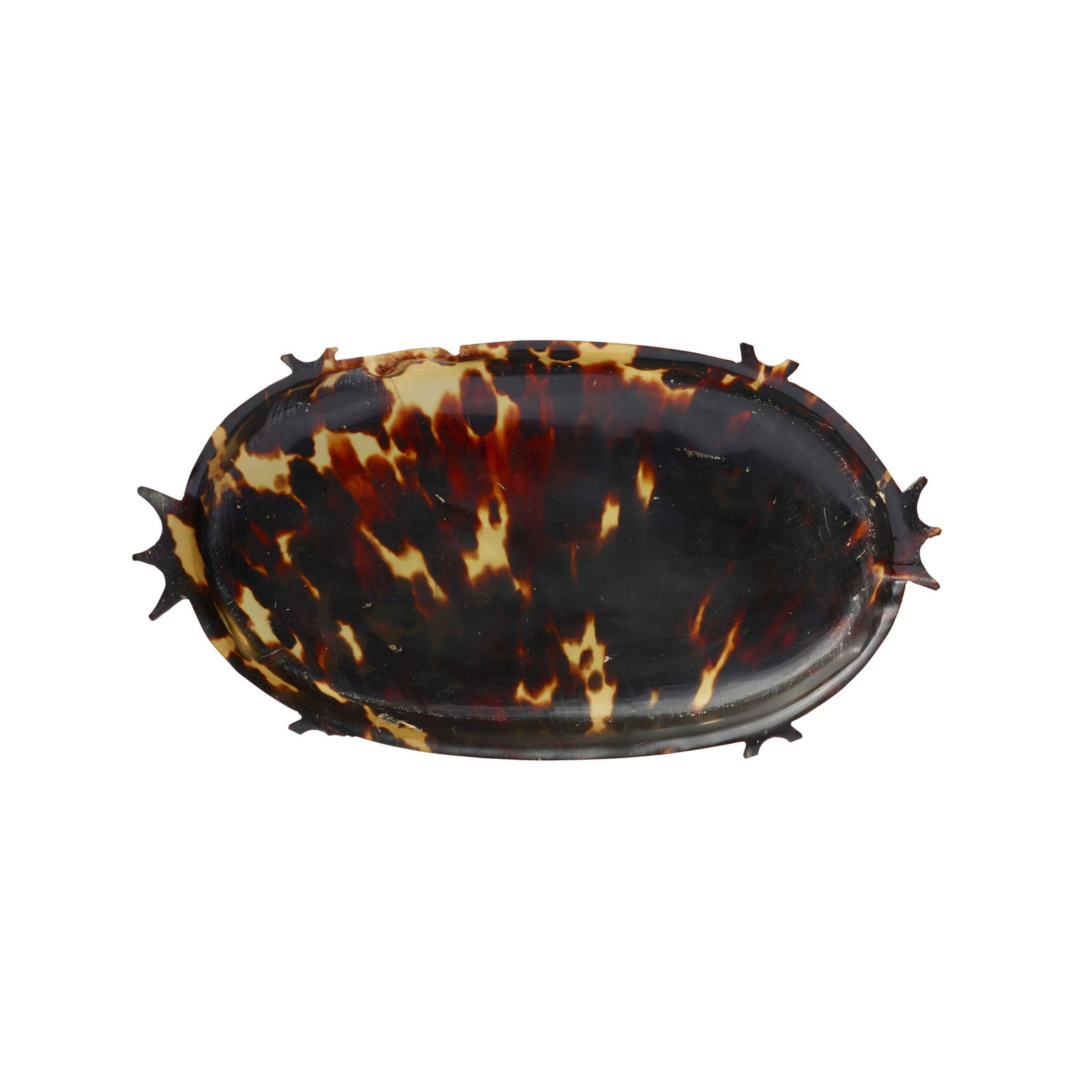 CAROLINE ISLANDS "TOLUK" DISH: CAROLINE ISLANDS "TOLUK" DISH PALAU, EARLY 20TH CENTURY carved and polished turtle shell, the shallow dish with steep walls and a series of fourteen spiked projections 17.5cm long Provenance: &nb