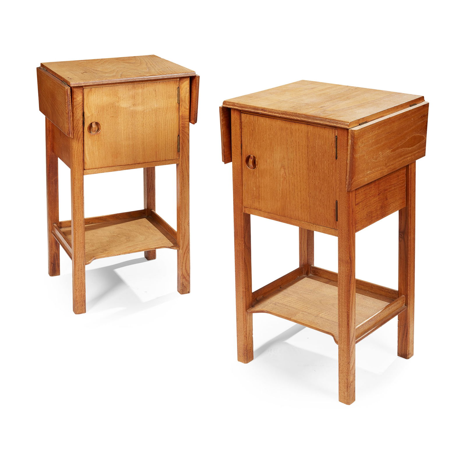 AMBROSE HEAL (1872-1959) FOR HEAL & SON: AMBROSE HEAL (1872-1959) FOR HEAL & SON PAIR OF BEDSIDE TABLES, CIRCA 1910 unpolished chestnut, model 392 (2) 42.5cm wide, 77cm high, 38.5cm deep, 71cm long extended Provenance: From The Milline