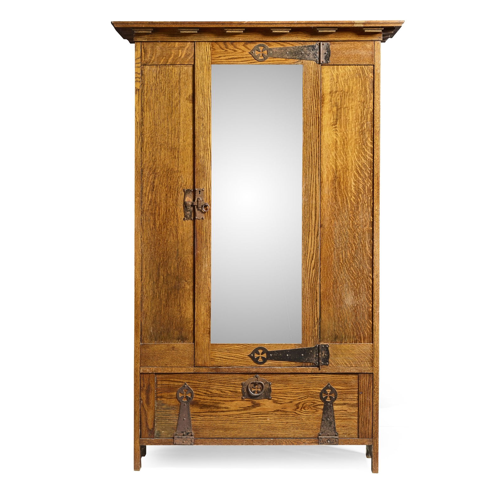 AMBROSE HEAL (1872-1959) FOR HEAL & SON: AMBROSE HEAL (1872-1959) FOR HEAL & SON 'ST. IVES' ARTS & CRAFTS WARDROBE, CIRCA 1897 oak, with patinated steel fittings and bevelled mirror plate 125.3cm wide, 195.5cm high, 55.8cm deep Literature: H