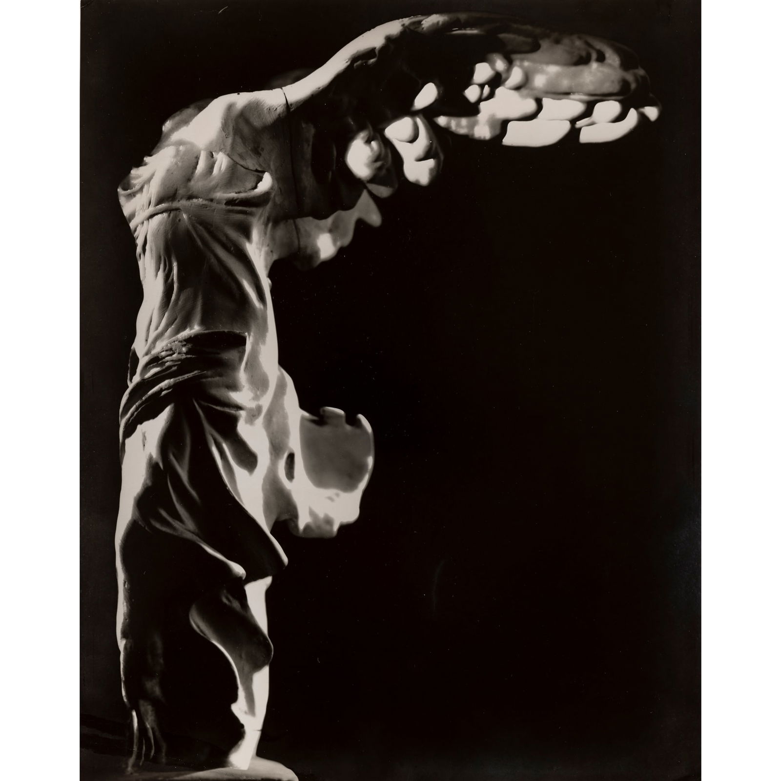 § ERWIN BLUMENFELD (GERMAN / AMERICAN 1897-1969): ERWIN BLUMENFELD (GERMAN / AMERICAN 1897-1969) VICTORY OF SAMOTHRACE, LOUVRE, PARIS, c.1930s stamped with Artist's Estate stamp (to reverse), vintage gelatin silver print, aside from an edition 