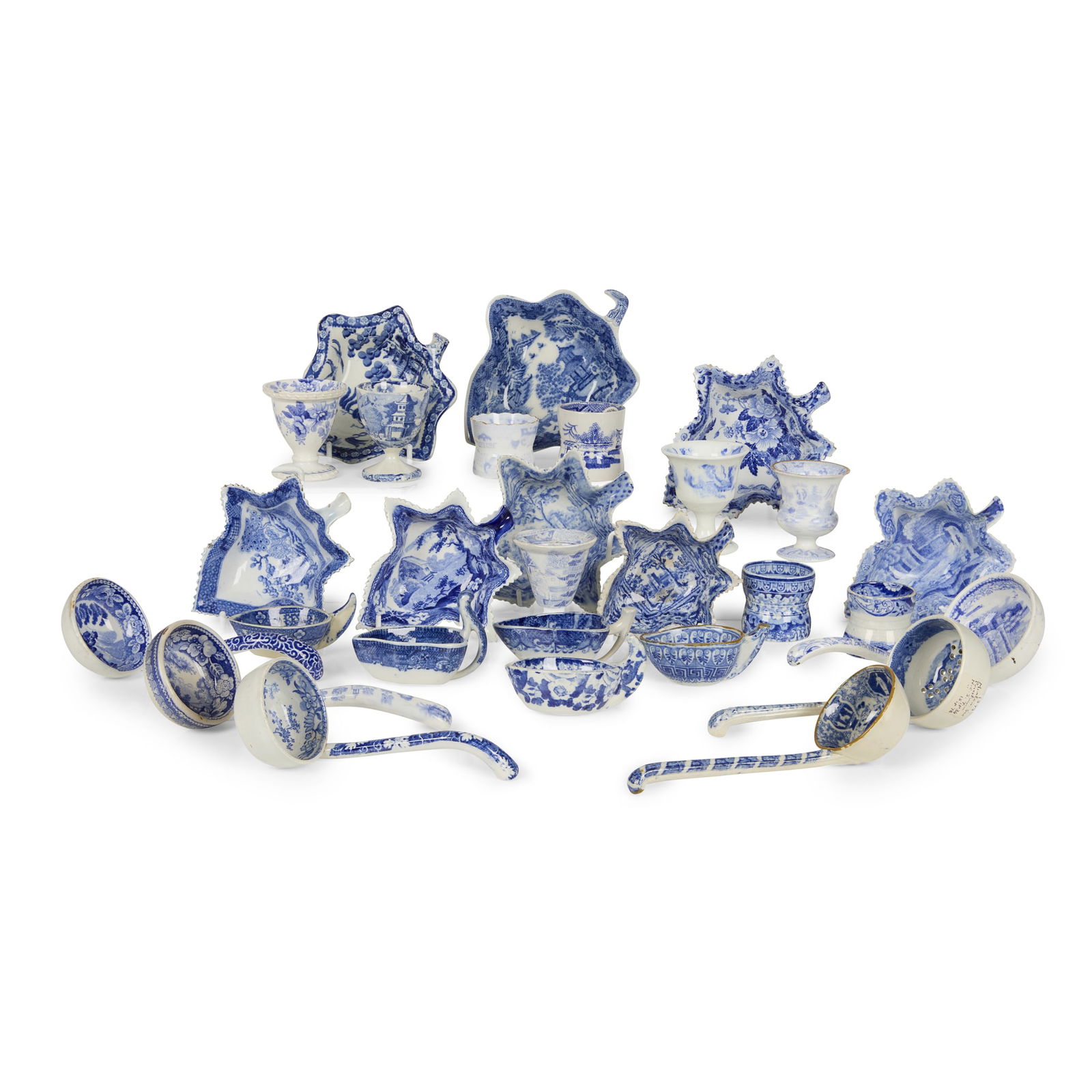COLLECTION OF BLUE AND WHITE TRANSFER PRINTED VINE PICKLE DISHES, LADLES, EGG HOOPS AND EGG CUPS: COLLECTION OF BLUE AND WHITE TRANSFER PRINTED VINE PICKLE DISHES, LADLES, EGG HOOPS AND EGG CUPS 19TH CENTURY comprising eight pickle dishes including two Ridgway ‘Angus Seats’ examples, a