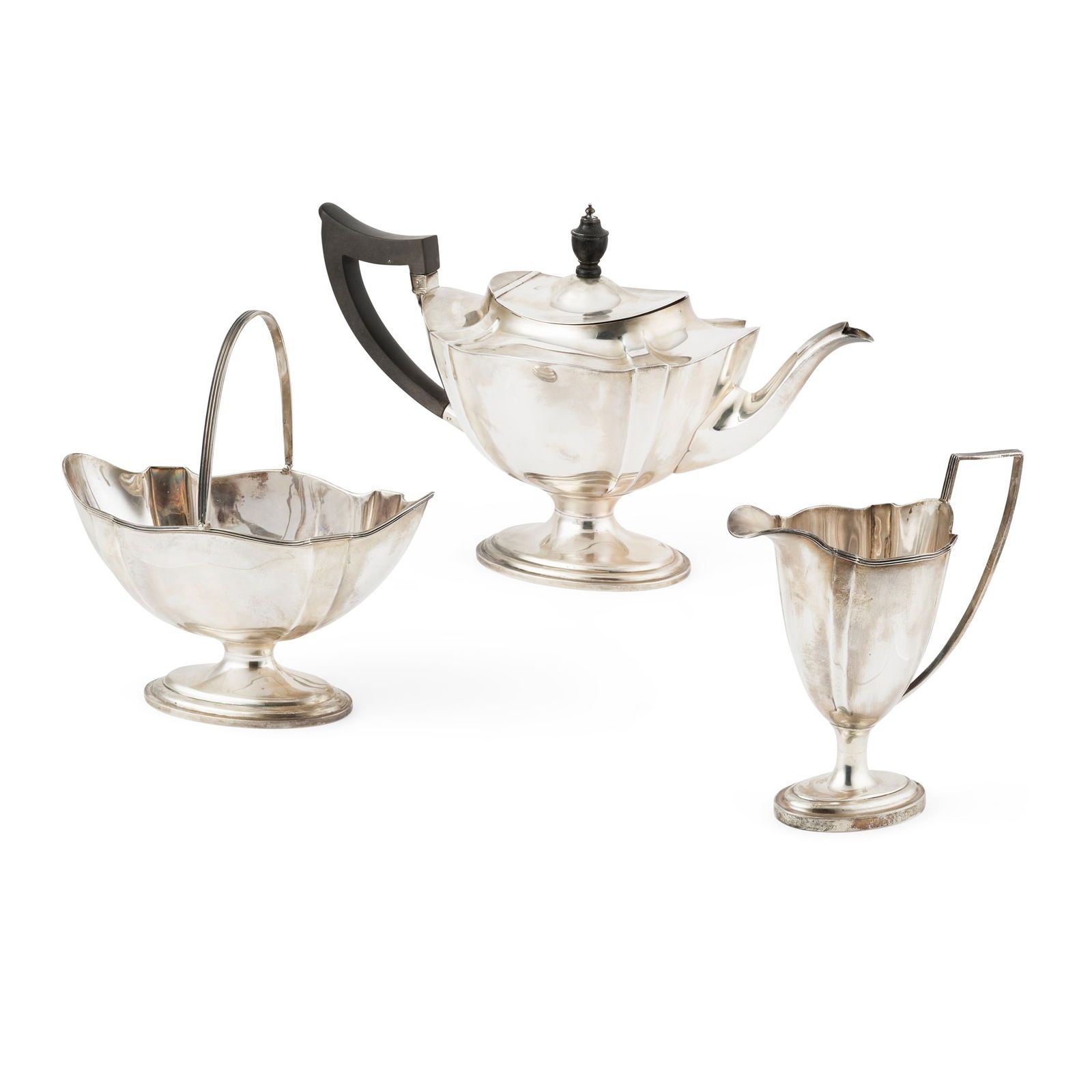 A 1920s THREE PIECE TEA SERVICE: A 1920s THREE PIECE TEA SERVICE MAPPIN & WEBB, SHEFFIELD 1923 Comprising a teapot, swing-handled sugar basket and milk jug, all of lobed form with an undulating border with a threaded detail to the su