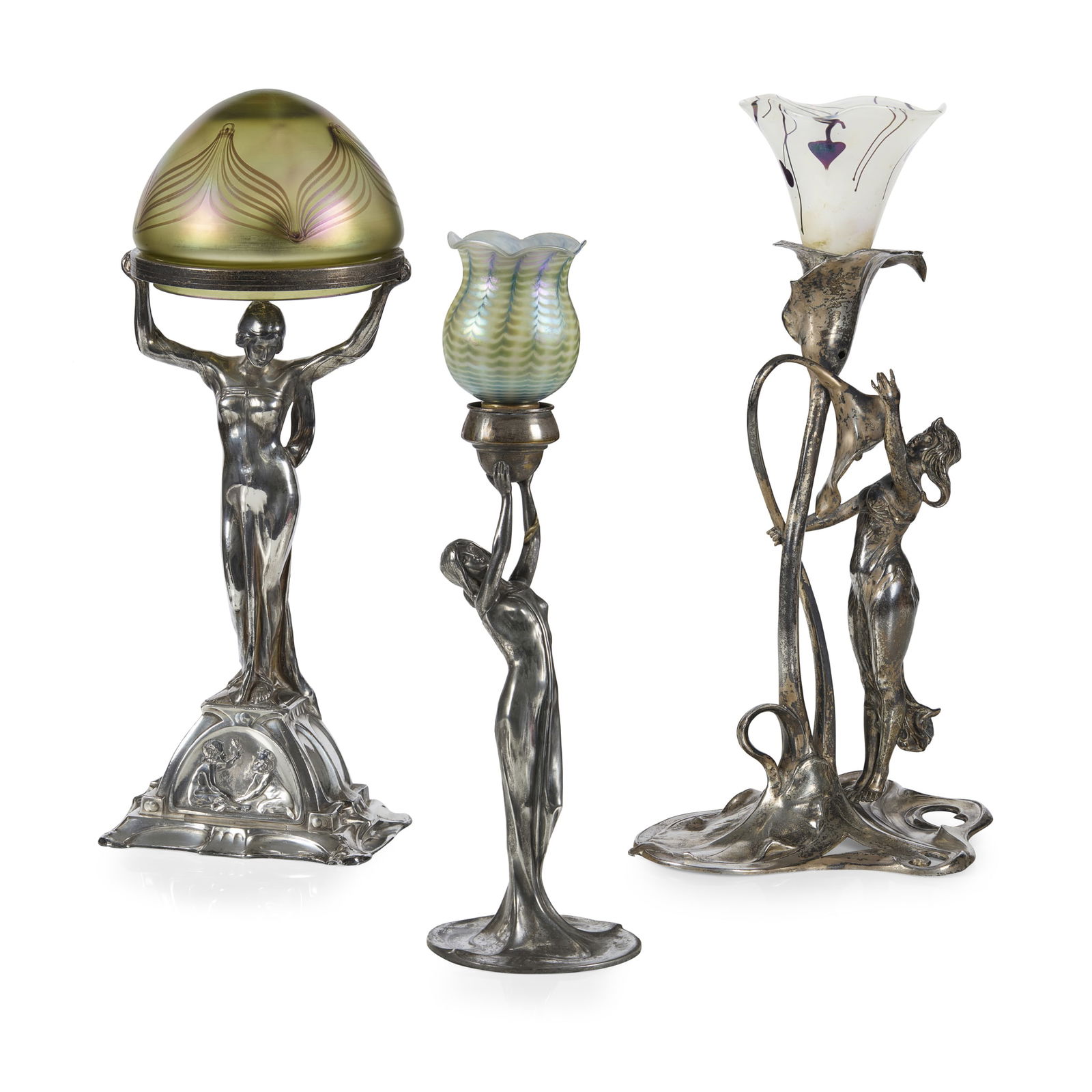 WMF (WURTTEMBERGISCHE METALLWARENFABRIK): WMF (WURTTEMBERGISCHE METALLWARENFABRIK) JUGENDSTIL TABLE LAMP, CIRCA 1900 silvered metal, with associated Loetz glass shade, 44cm high; together with TWO FURTHER TABLE LAMPS, silvered metal with asso