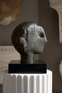 § HENRY MOORE O.M., C.H. (BRITISH 1898-1986): HENRY MOORE O.M., C.H. (BRITISH 1898-1986) STUDY FOR HEAD OF QUEEN NO. 2 signed Moore and numbered 7/9, bronze with green/brown patina the bronze: 23.5cm high (9 ¼in high); overall: 29cm high (