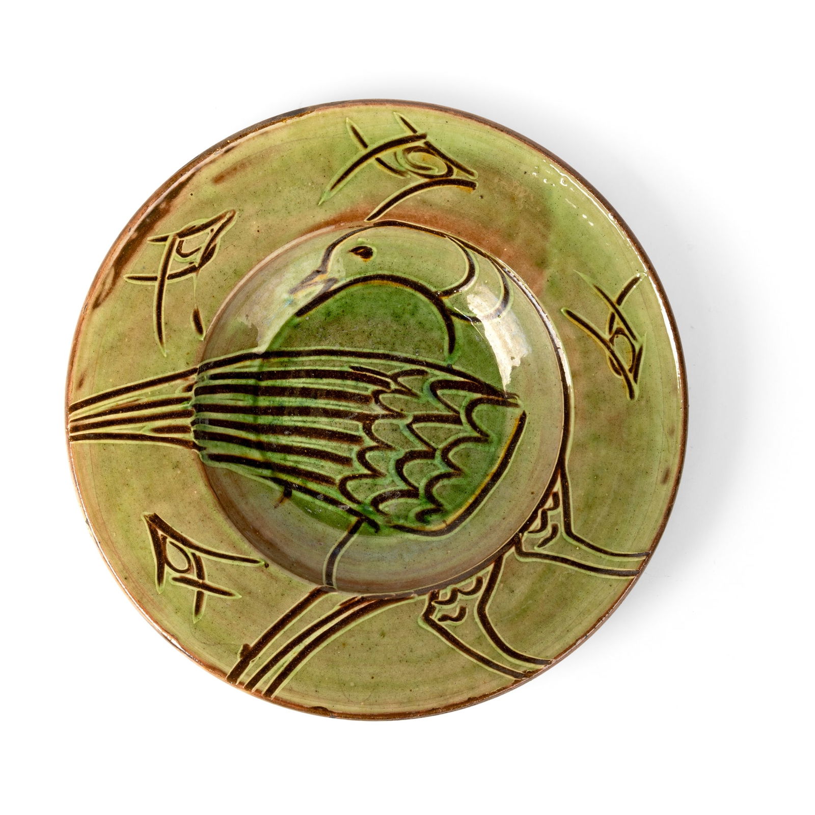 § MICHAEL CARDEW C.B.E. (BRITISH 1901-1983) AT WINCHCOMBE POTTERY: MICHAEL CARDEW C.B.E. (BRITISH 1901-1983) AT WINCHCOMBE POTTERY CHARGER WITH BIRD, c. 1930 impressed maker's and pottery marks, earthenware 5.5cm high, 36cm diameter (2 1/8in high, 14 1/8in diameter)