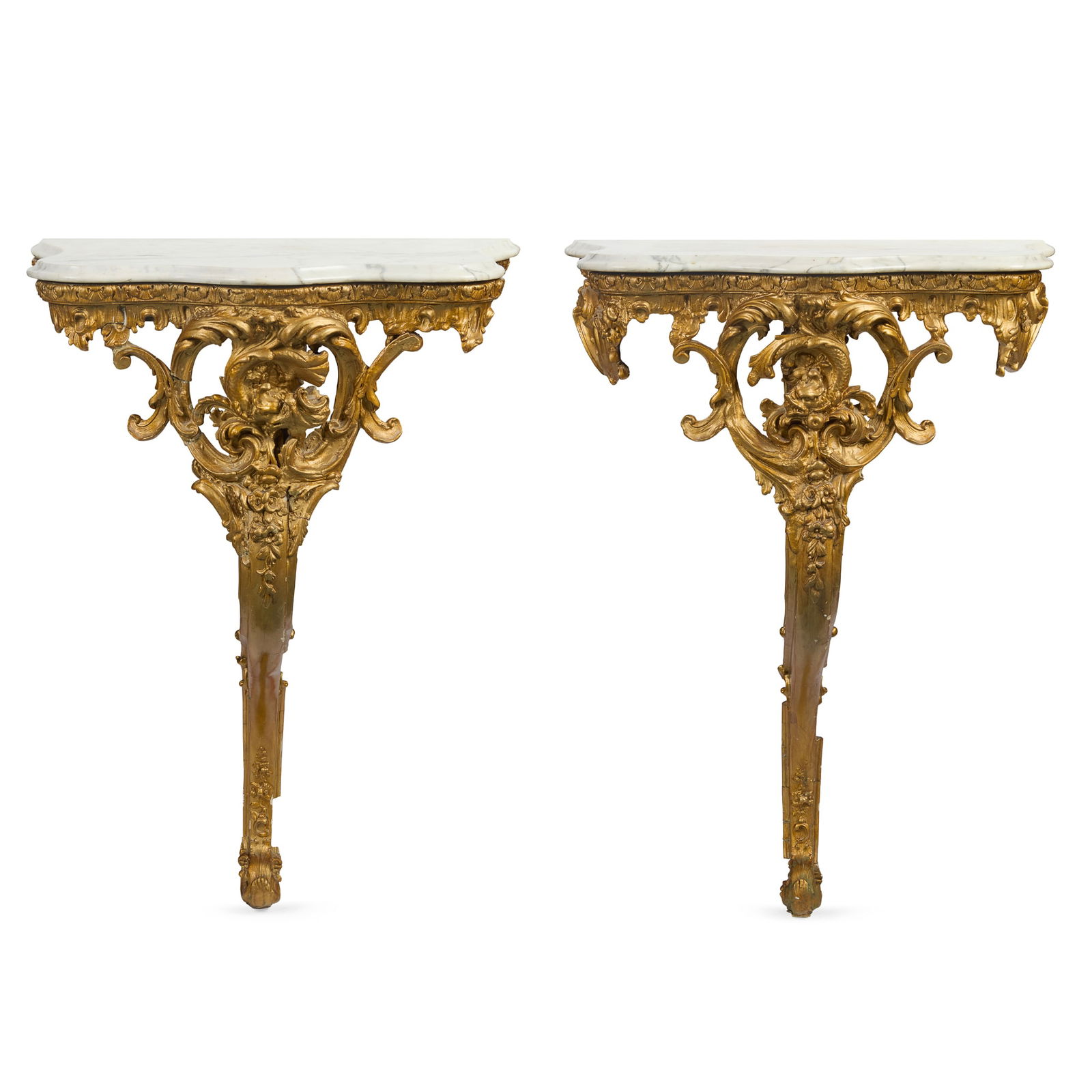 PAIR OF CONTINENTAL GILTWOOD MARBLE TOPPED CONSOLE TABLES: PAIR OF CONTINENTAL GILTWOOD MARBLE TOPPED CONSOLE TABLES 19TH CENTURY the serpentine veined white marble tops with a moulded edge; the bases with water leaves, rocaille, C-scrolls and a scrolling dra