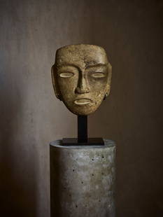 TEOTIHUACAN STONE MASK: TEOTIHUACAN STONE MASK MEXICO, C. 200 - 700 A.D. carved and polished greenstone, of rectangular form with drilled almond eyes, a broad nose, and an incised mouth, the surface exhibits signs of wear an