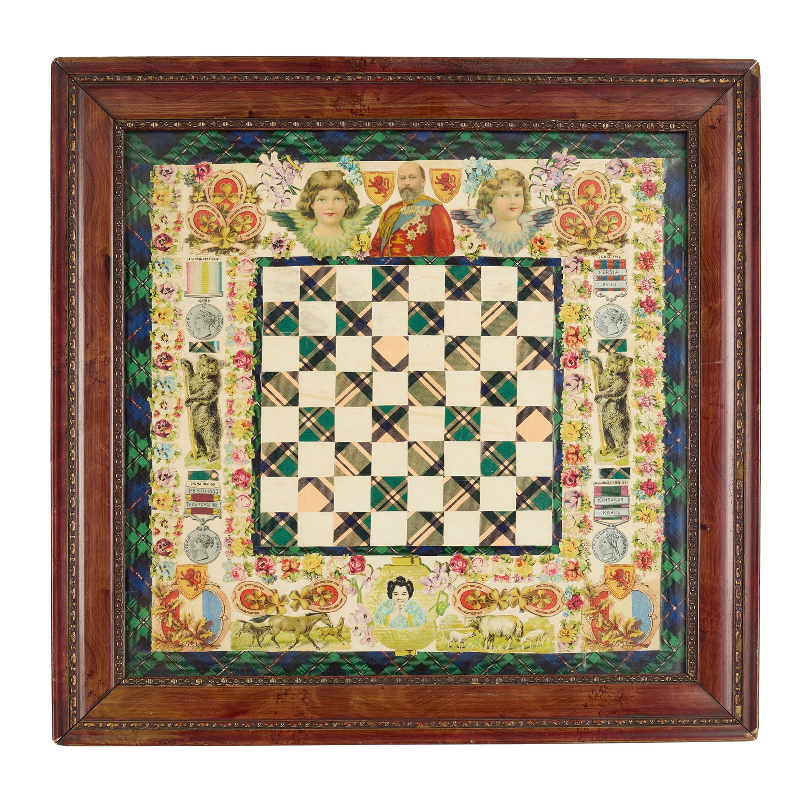AN EDWARDIAN SCRAPWORK CHESS BOARD PANEL: AN EDWARDIAN SCRAPWORK CHESS BOARD PANEL EARLY 20TH CENTURY the decoupage panel formed of a central green tartan checked board framed by a wide border of scraps, centred by an image of Edward VII, fra