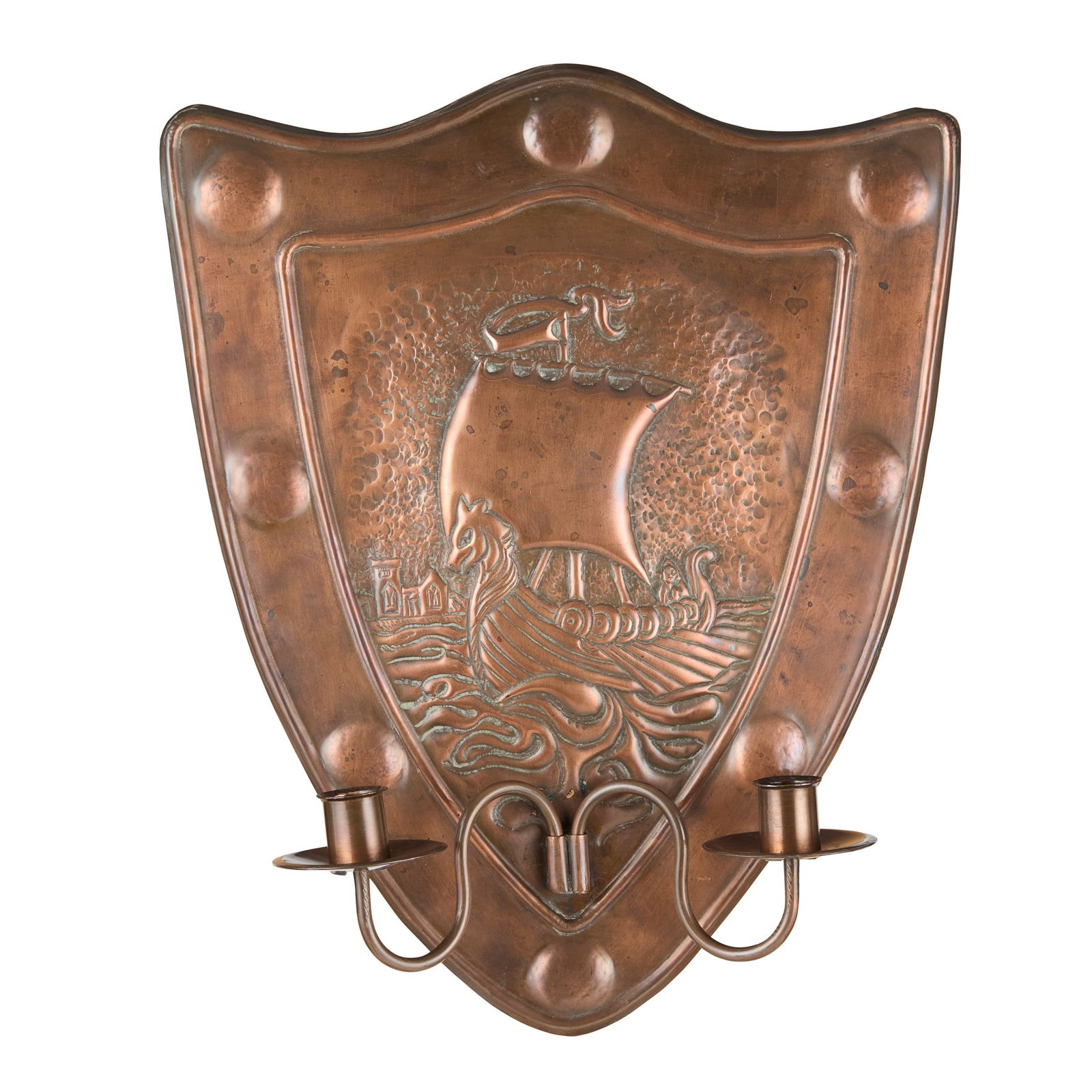 IONA - A SCOTTISH PROVINCIAL COPPER TWIN LIGHT WALL SCONCE: IONA - A SCOTTISH PROVINCIAL COPPER TWIN LIGHT WALL SCONCE ALEXANDER RITCHIE The shield shaped back plate with eight domed bosses within border, enclosing a galleon in full sail with Iona abbey in the