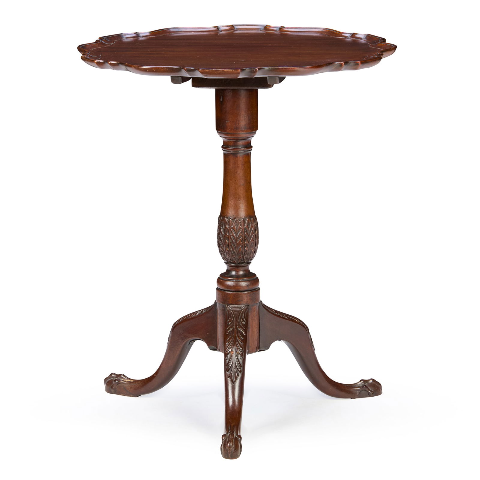 LATE GEORGE II/ EARLY GEORGE III MAHOGANY TILT TOP PIECRUST TEA TABLE: LATE GEORGE II/ EARLY GEORGE III MAHOGANY TILT TOP PIECRUST TEA TABLE MID 18TH CENTURY the shaped circular top with a moulded edge, on an acanthus carved baluster column and cabriole legs carved with