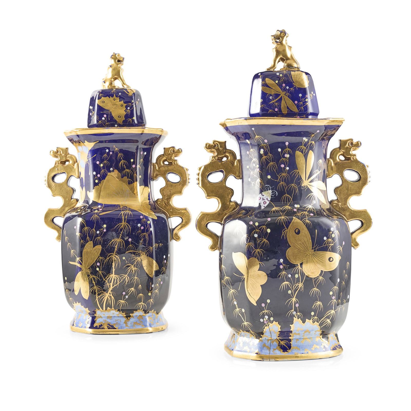 PAIR OF FRENCH JAPONISME STONE CHINA COVERED VASES: PAIR OF FRENCH JAPONISME STONE CHINA COVERED VASES 19TH CENTURY the domed covers with fu-dog finials, on panelled bodies and twin chilong handles, decorated with gilt and enamel butterflies on cobalt 