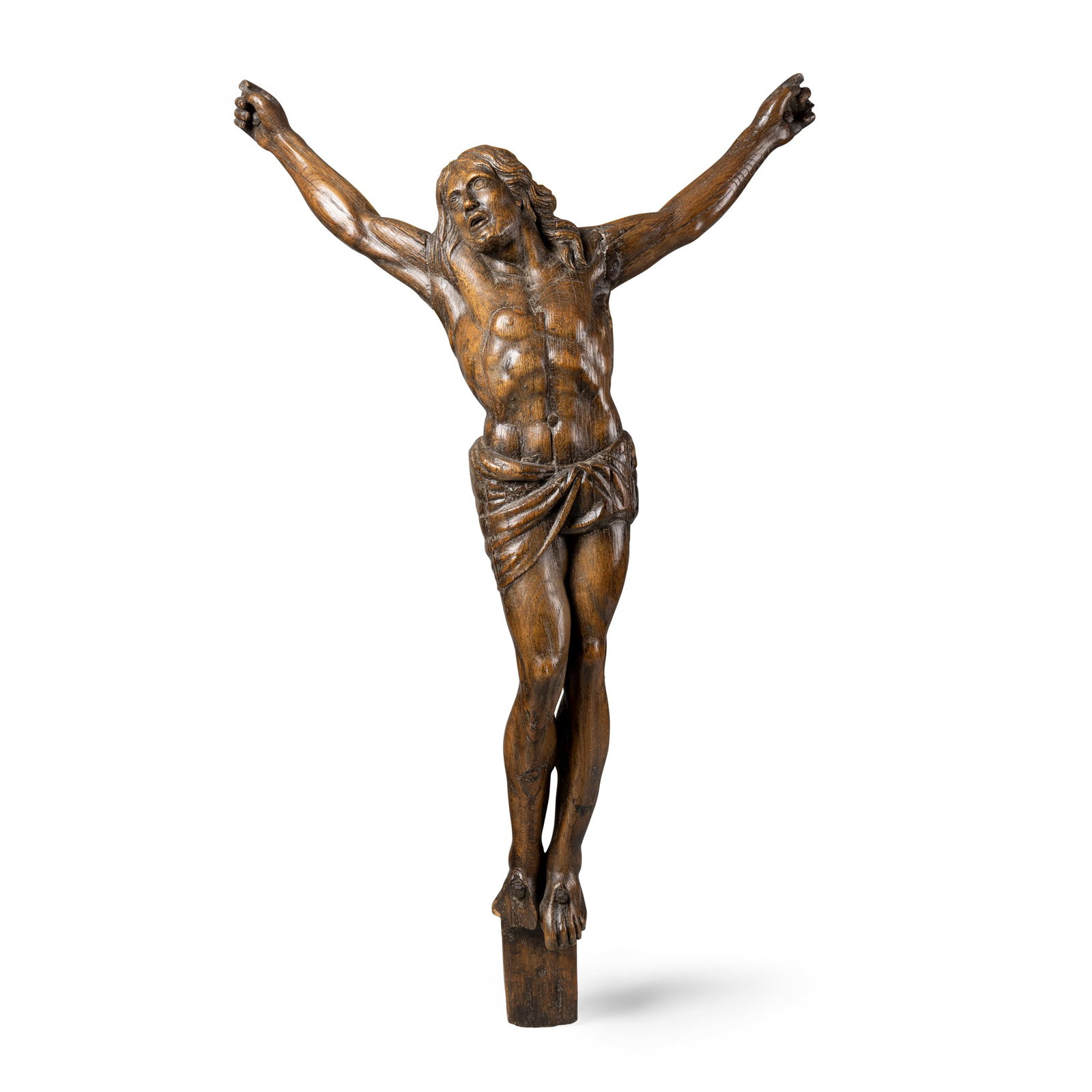 A CARVED OAK CRUCIFIX: A CARVED OAK CRUCIFIX LATE 18TH/ EARLY 19TH CENTURY With iron suspension ring to back 131cm high
