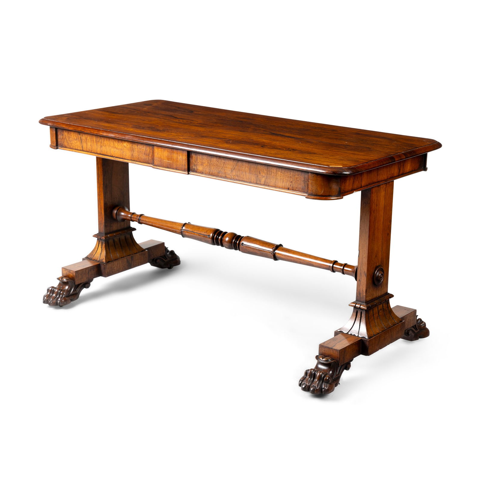 Y A ROSEWOOD CENTRE TABLE: A ROSEWOOD CENTRE TABLE MID 19TH CENTURY the rounded rectangular moulded top on trestle supports with boldly carved paw feet 138cm wide x 74cm high x 68cm deep