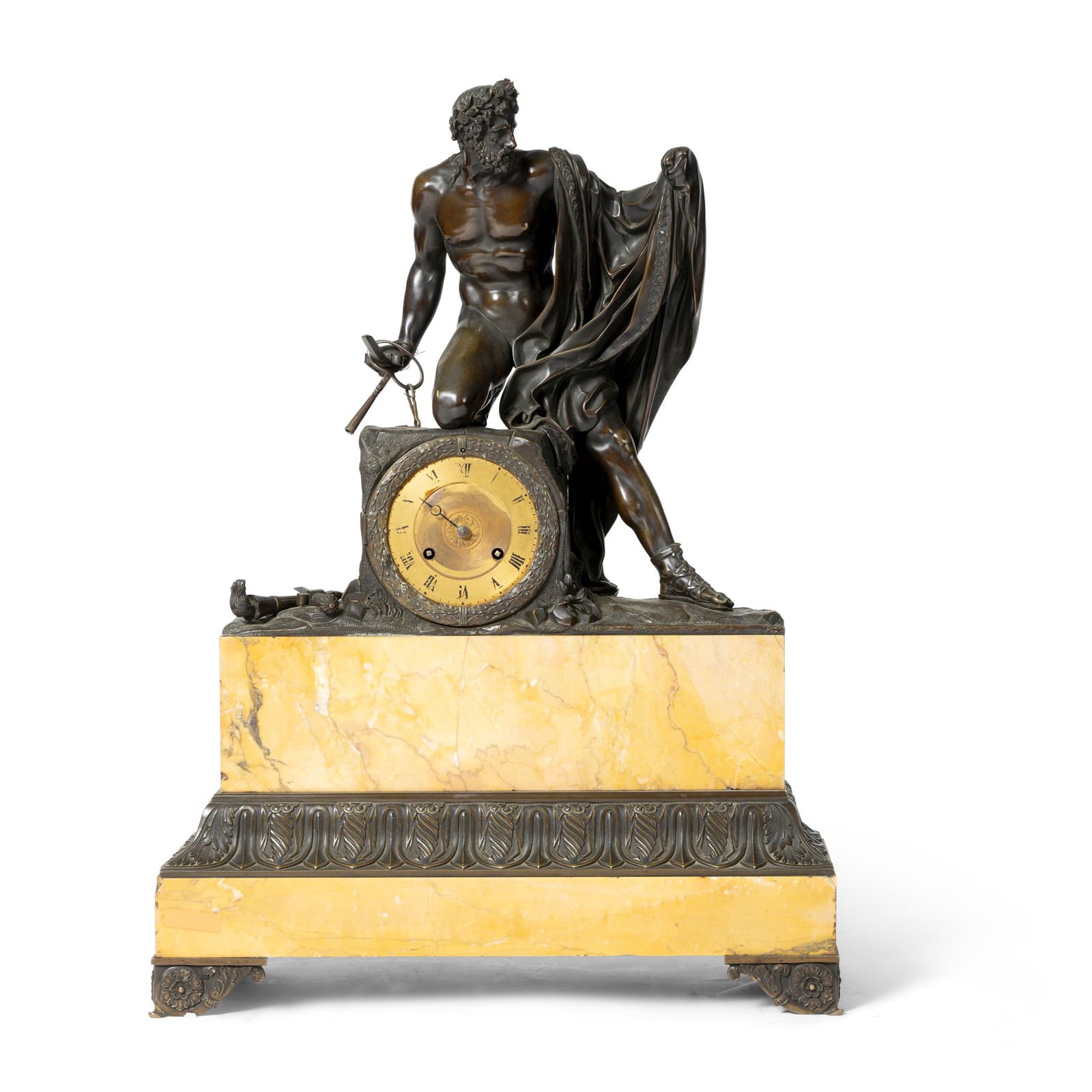 A FRENCH BRONZE AND SIENNA MARBLE MANTEL CLOCK: A FRENCH BRONZE AND SIENNA MARBLE MANTEL CLOCK MID 19TH CENTURY modelled as a Classical warrior, kneeling on a gilt clock dial with Roman numerals, on raised gilt bronze mounted plinth base and bracke