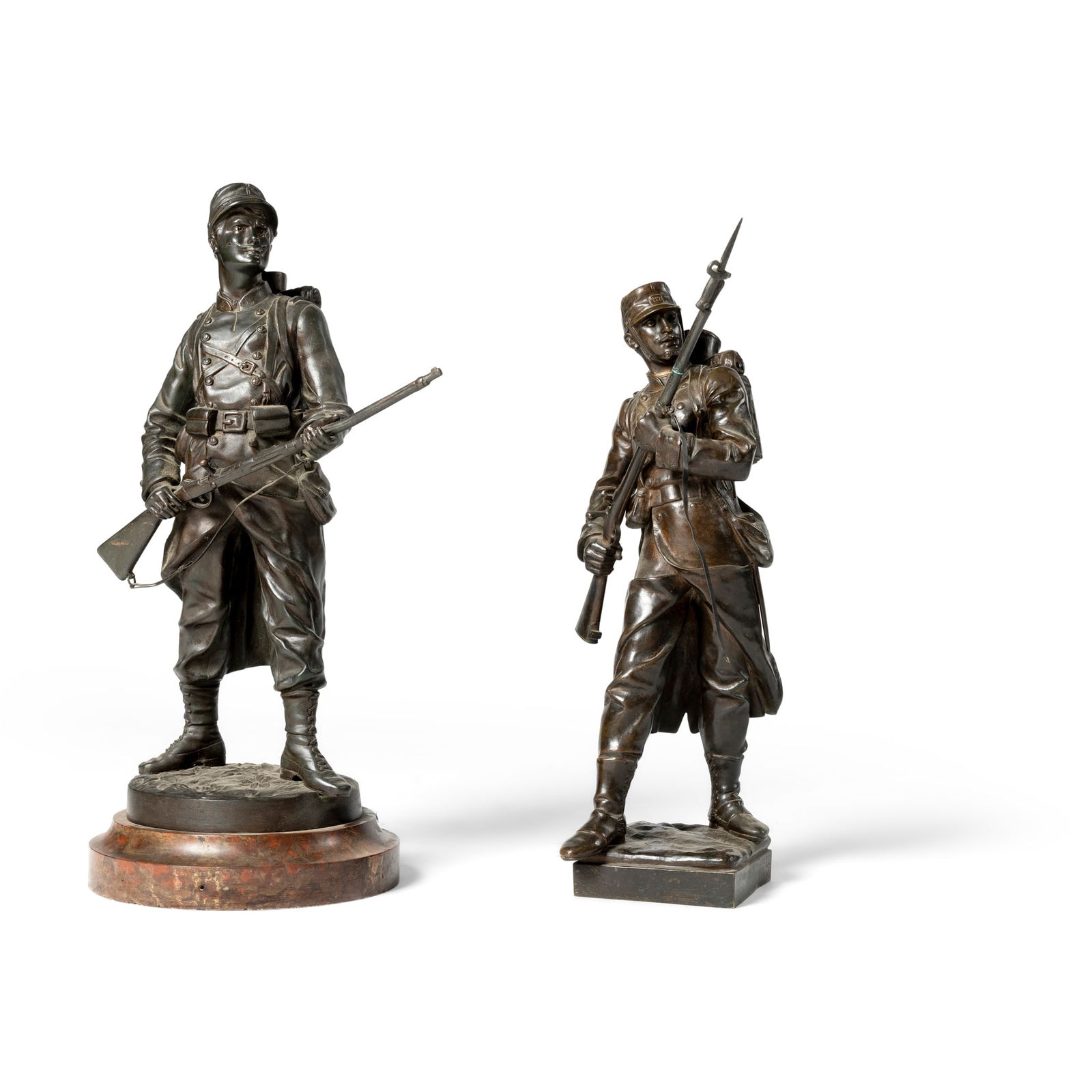 A BRONZE FIGURE OF A SOLDIER OF THE FRANCO PRUSSIAN WAR, EUGENE MARIOTON (FRENCH 1854-1933): A BRONZE FIGURE OF A SOLDIER OF THE FRANCO PRUSSIAN WAR, EUGENE MARIOTON (FRENCH 1854-1933) LATE 19TH CENTURY Signed to the plinth base, together with another similar figure group of a solider the bas
