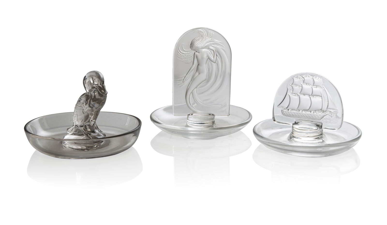 RENÉ LALIQUE (1860-1945): RENÉ LALIQUE (1860-1945) CANARD CENDRIER, NO. 283 designed 1925clear and frostedengraved R. Lalique;together with CARAVELLE and NAÏADE cendriers, executed Post-War, engraved Lalique France(3