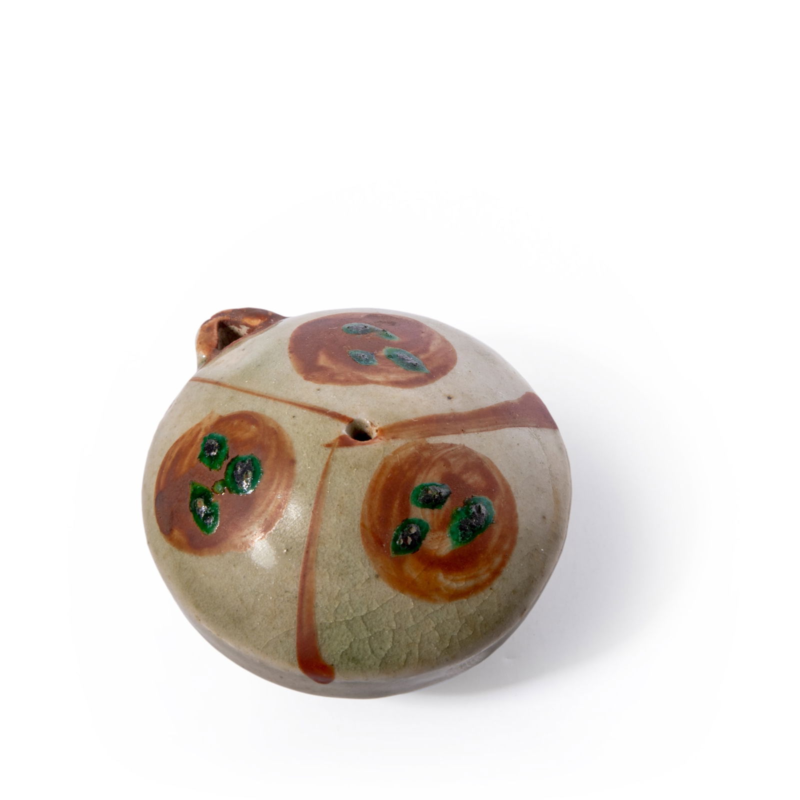 SHOJI HAMADA (JAPANESE 1894-1978): SHOJI HAMADA (JAPANESE 1894-1978) WATER DROPPER stoneware, in Okinawa style with enamel decoration in red and green, in fitted box 3.5cm high, 6.2cm wide (1 3/8in high, 2 ½in wide) Literature:&nb