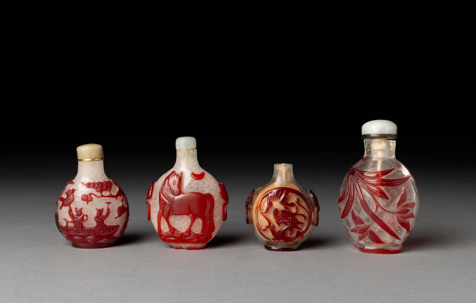 [COLLECTION OF PROF. J. GILBERT & CORA MCALLISTER] GROUP OF FOUR CHINESE RED OVERLAY GLASS SNUFF