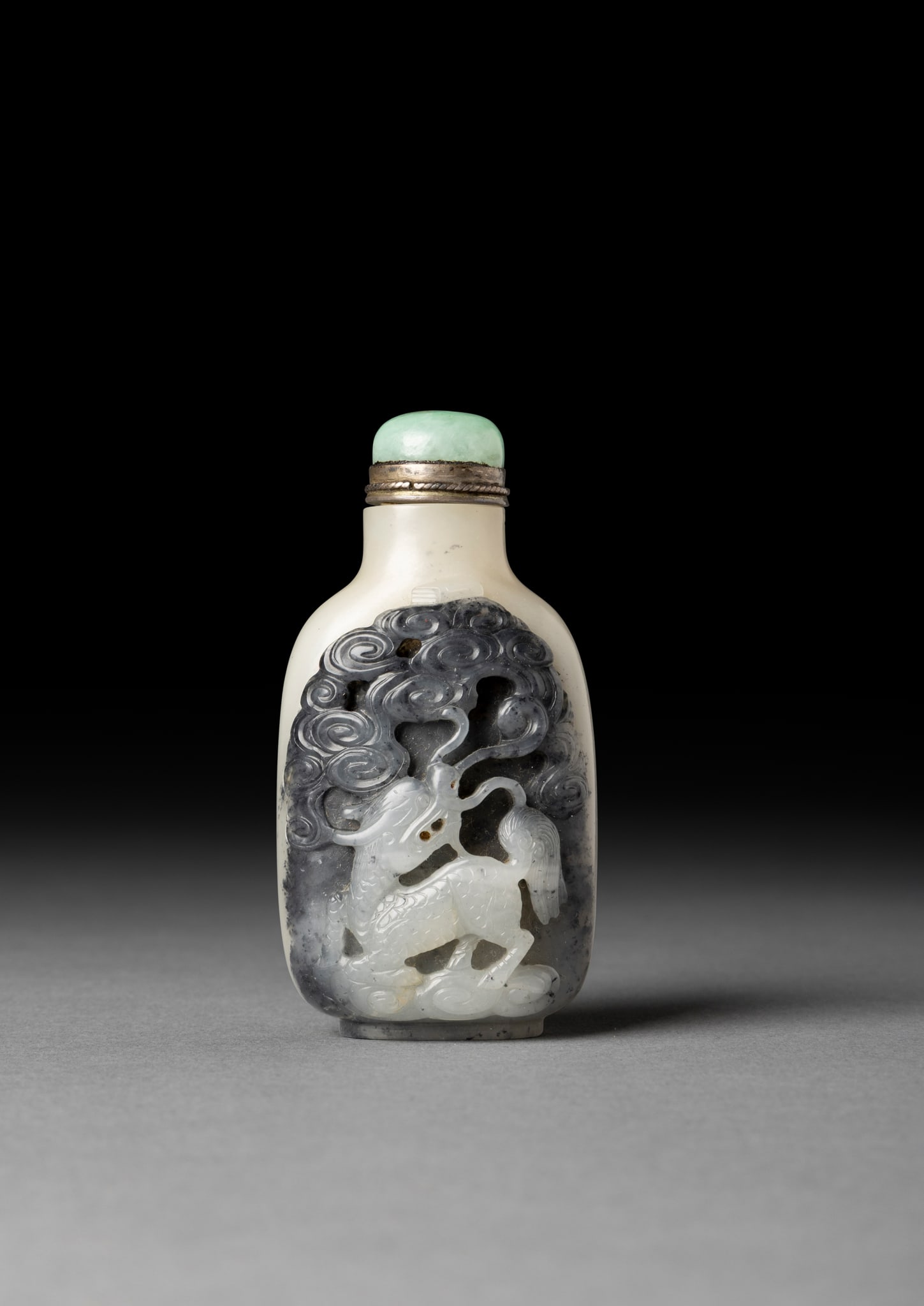 [COLLECTION OF PROF. J. GILBERT & CORA MCALLISTER] FINE CHINESE BLACK, GREY AND WHITE JADE 'QILIN'