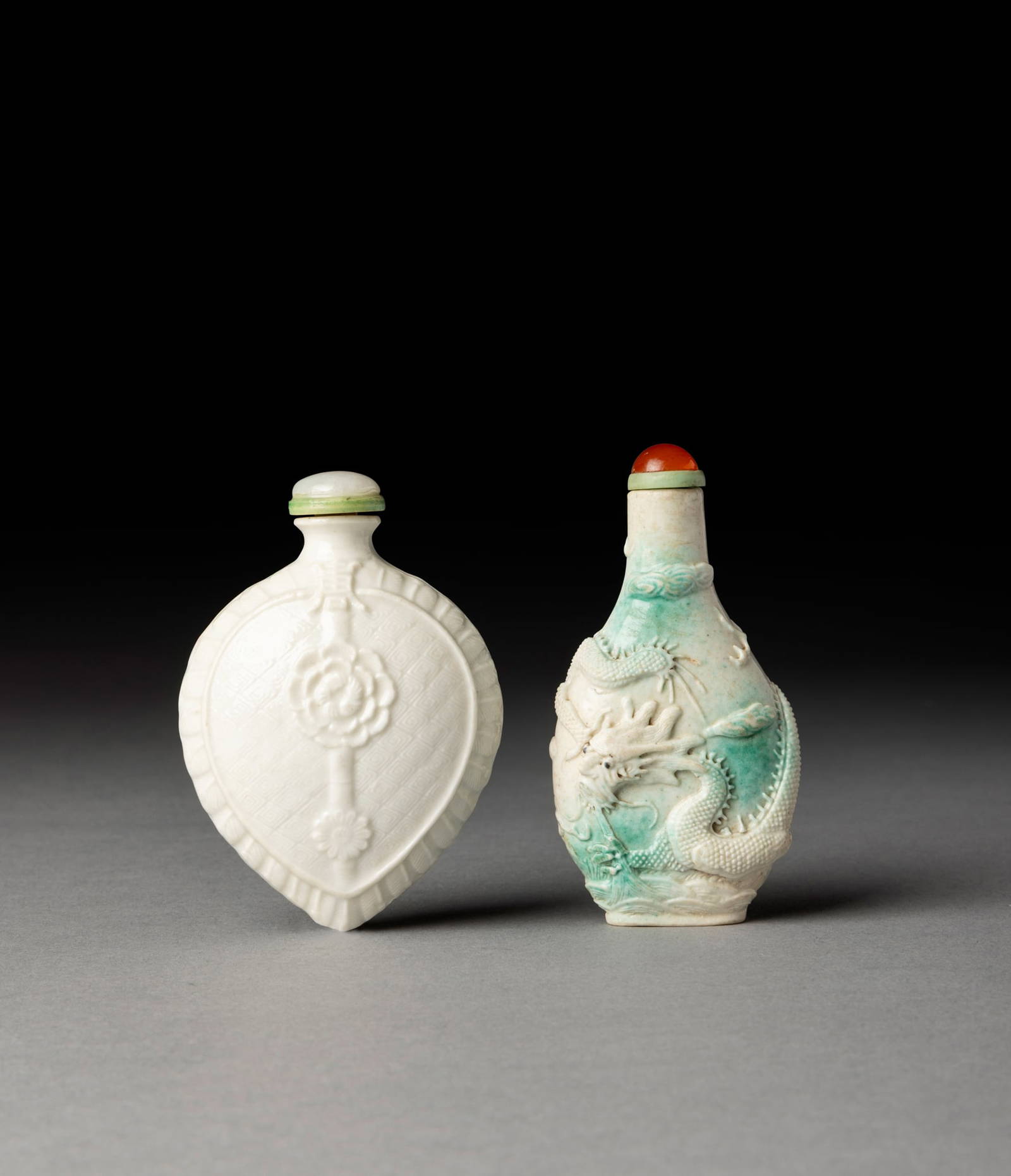 [COLLECTION OF PROF. J. GILBERT & CORA MCALLISTER] TWO CHINESE MOULDED BISCUIT PORCELAIN SNUFF