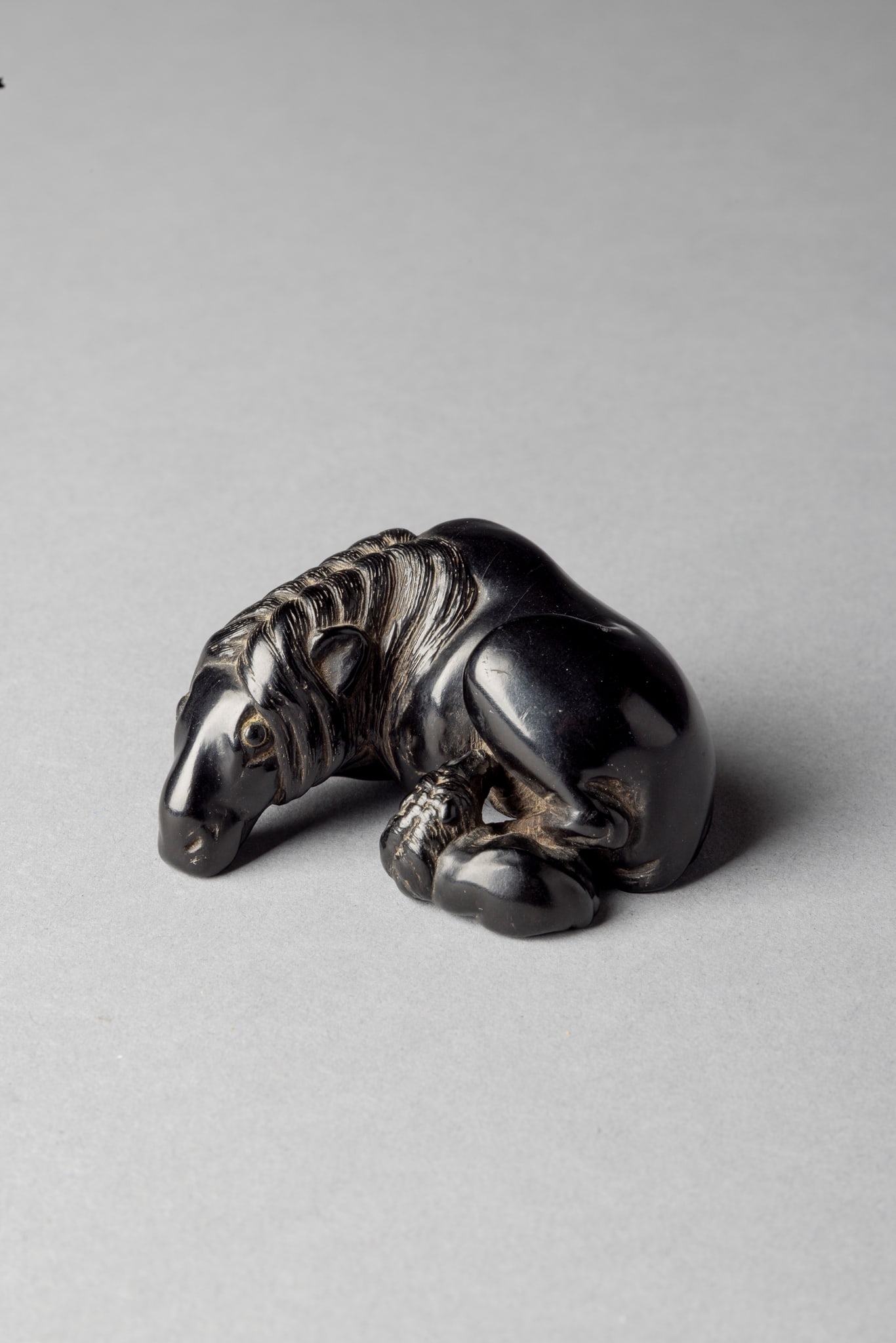 [COLLECTION OF PROF. J. GILBERT & CORA MCALLISTER] JAPANESE EBONY NETSUKE OF HORSES GROUP