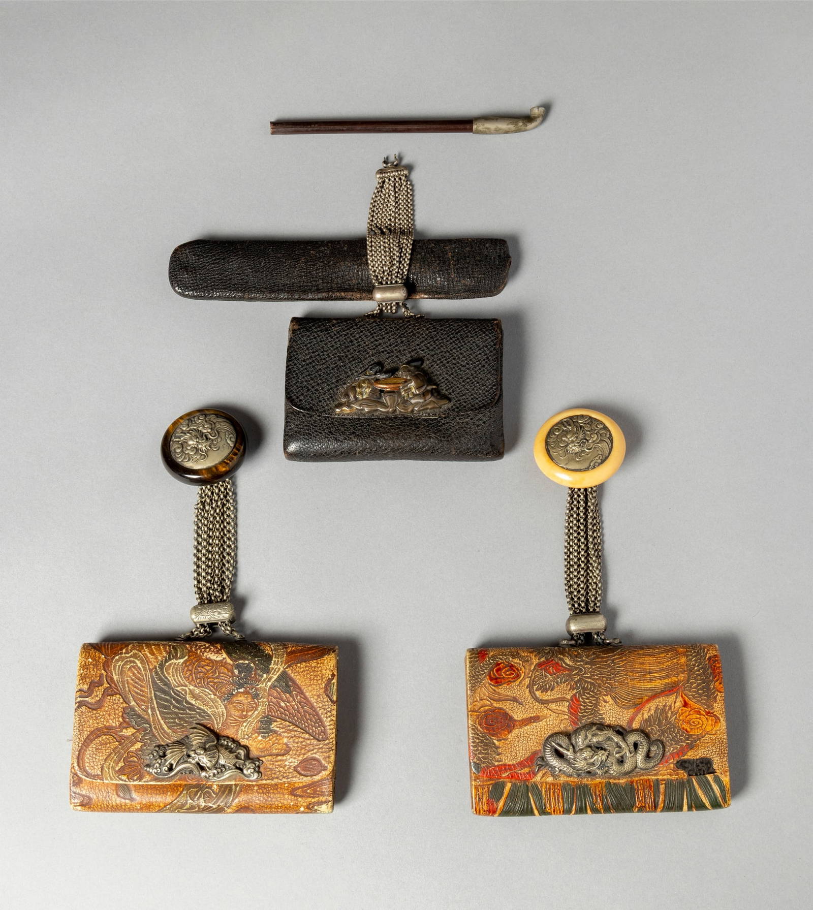 [COLLECTION OF PROF. J. GILBERT & CORA MCALLISTER] GROUP OF THREE JAPANESE LEATHER TABAKO-IRE WITH A