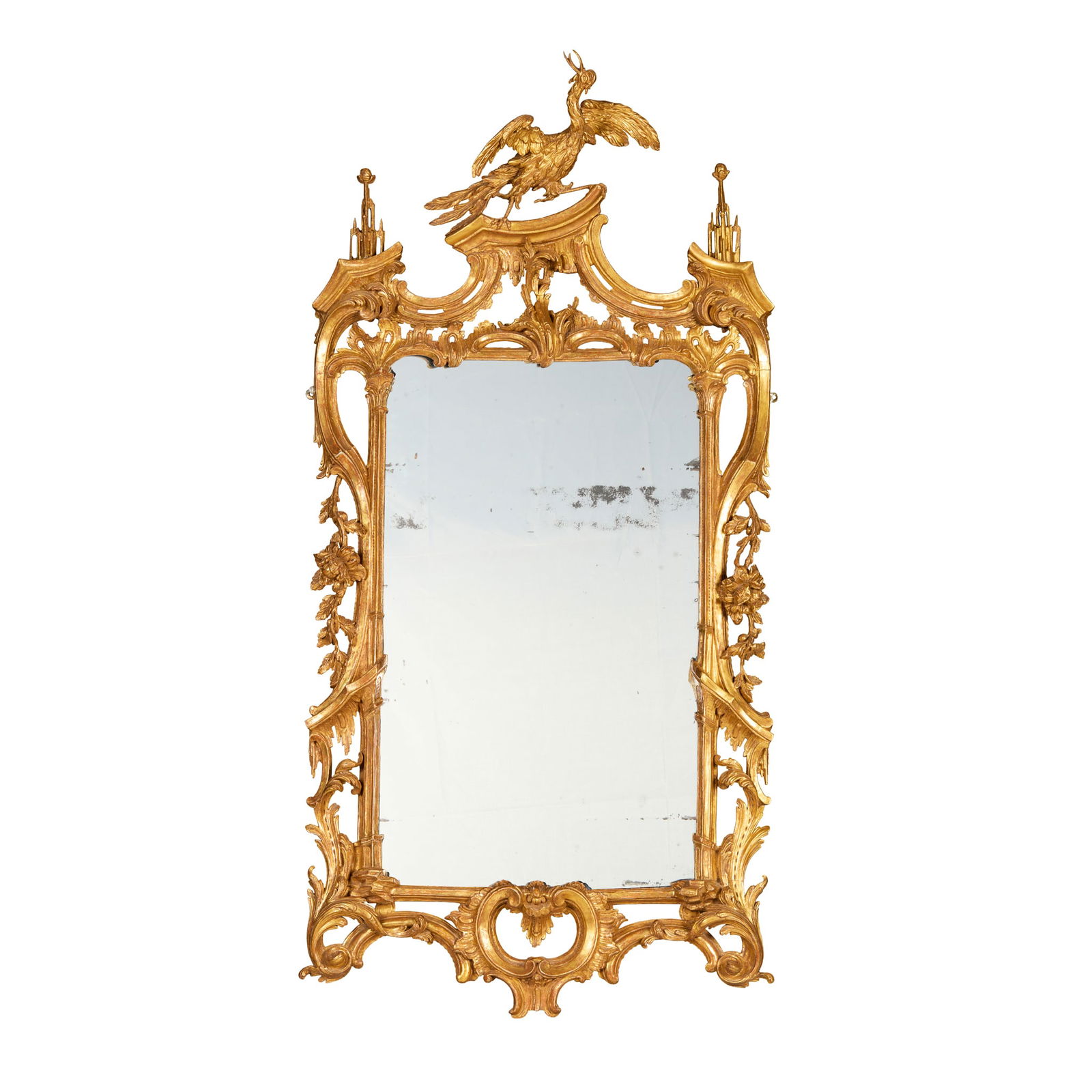 GEORGE III GILTWOOD MIRROR, IN THE MANNER OF THOMAS JOHNSON: GEORGE III GILTWOOD MIRROR, IN THE MANNER OF THOMAS JOHNSON 18TH CENTURY the shaped rectangular mirror plate in an openwork frame with acanthus and C scrolls, surmounted by a large ho-ho bird with roc