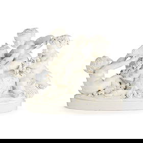 LARGE CAPODIMONTE BLANC DE CHINE FIGURE GROUP, SIGNED BEAUVAIS: LARGE CAPODIMONTE BLANC DE CHINE FIGURE GROUP, SIGNED BEAUVAIS LATE 19TH CENTURY modelled as a putto seated upon a goat, with two further putto at play alongside, with garlands of fruiting vines, on a